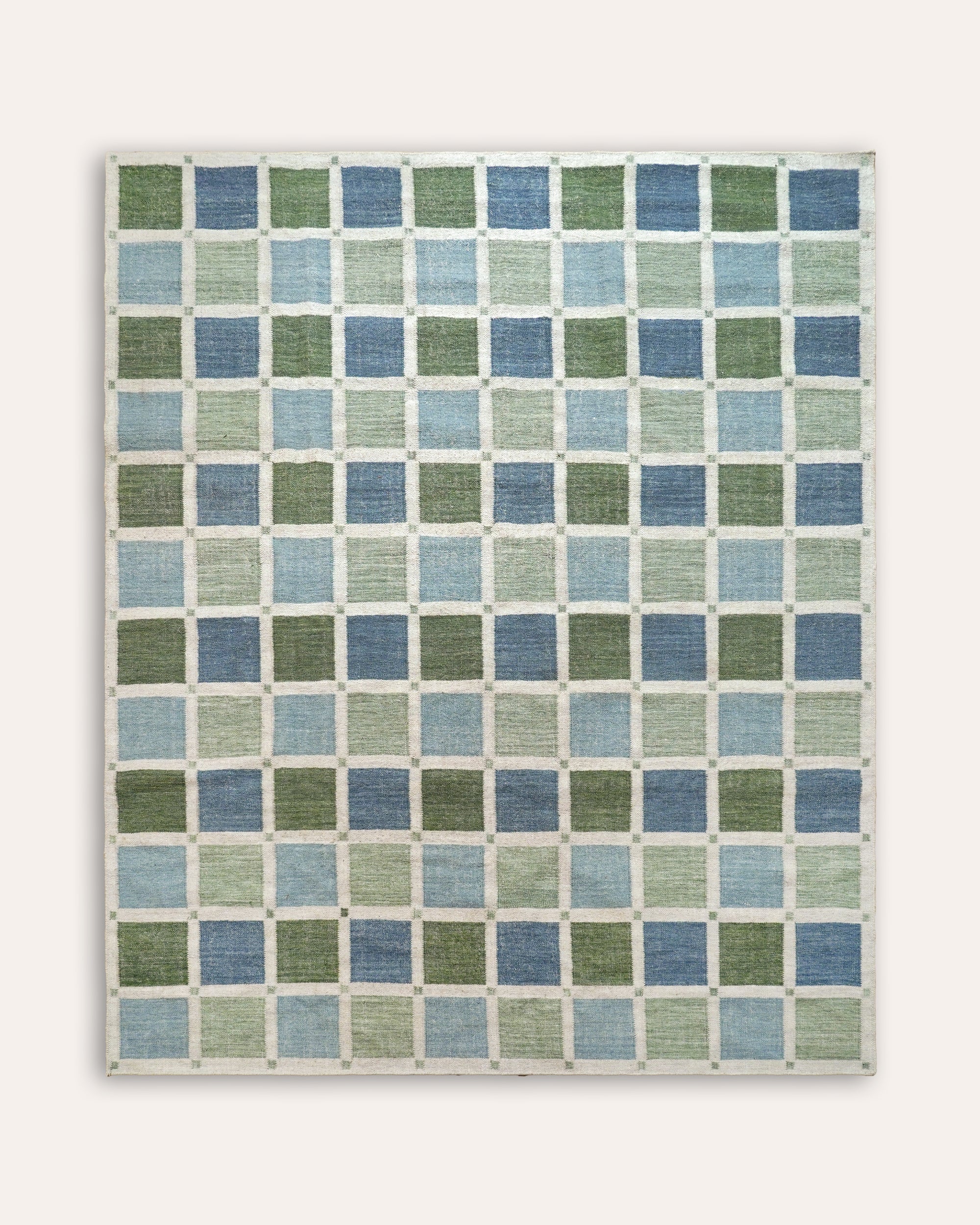 Rectangular flatweave rug with blue and green check squares