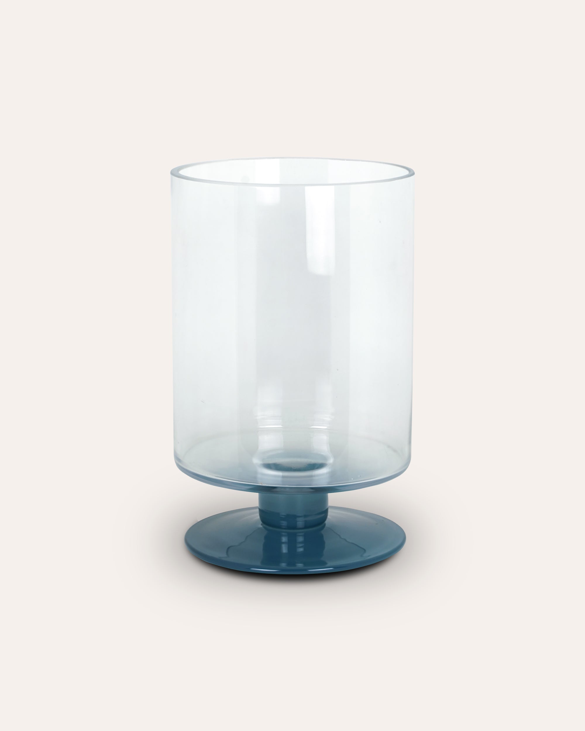 Blue glass vase on a white background