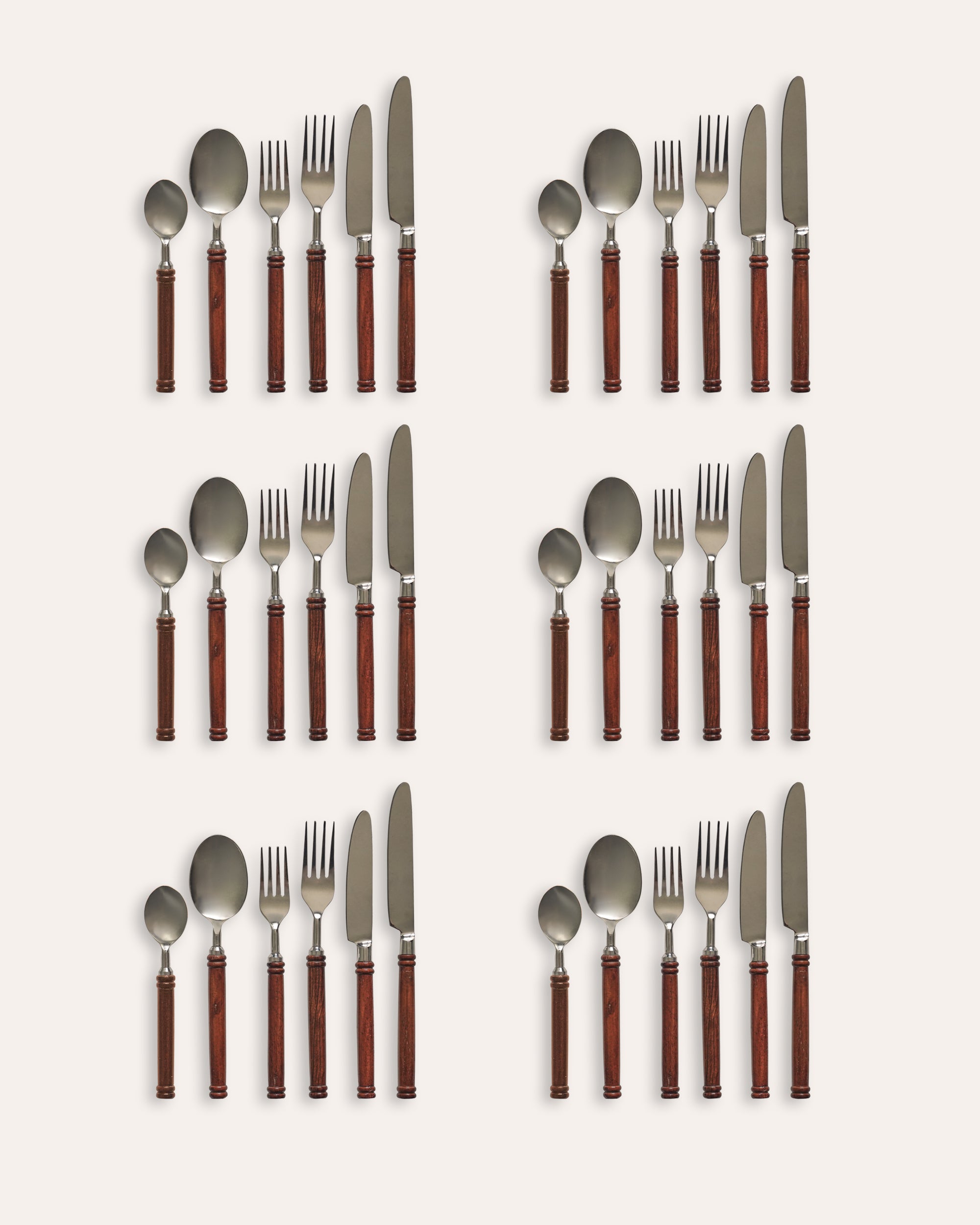 Set of 6 silverware with red handles arranged in a grid on a white background