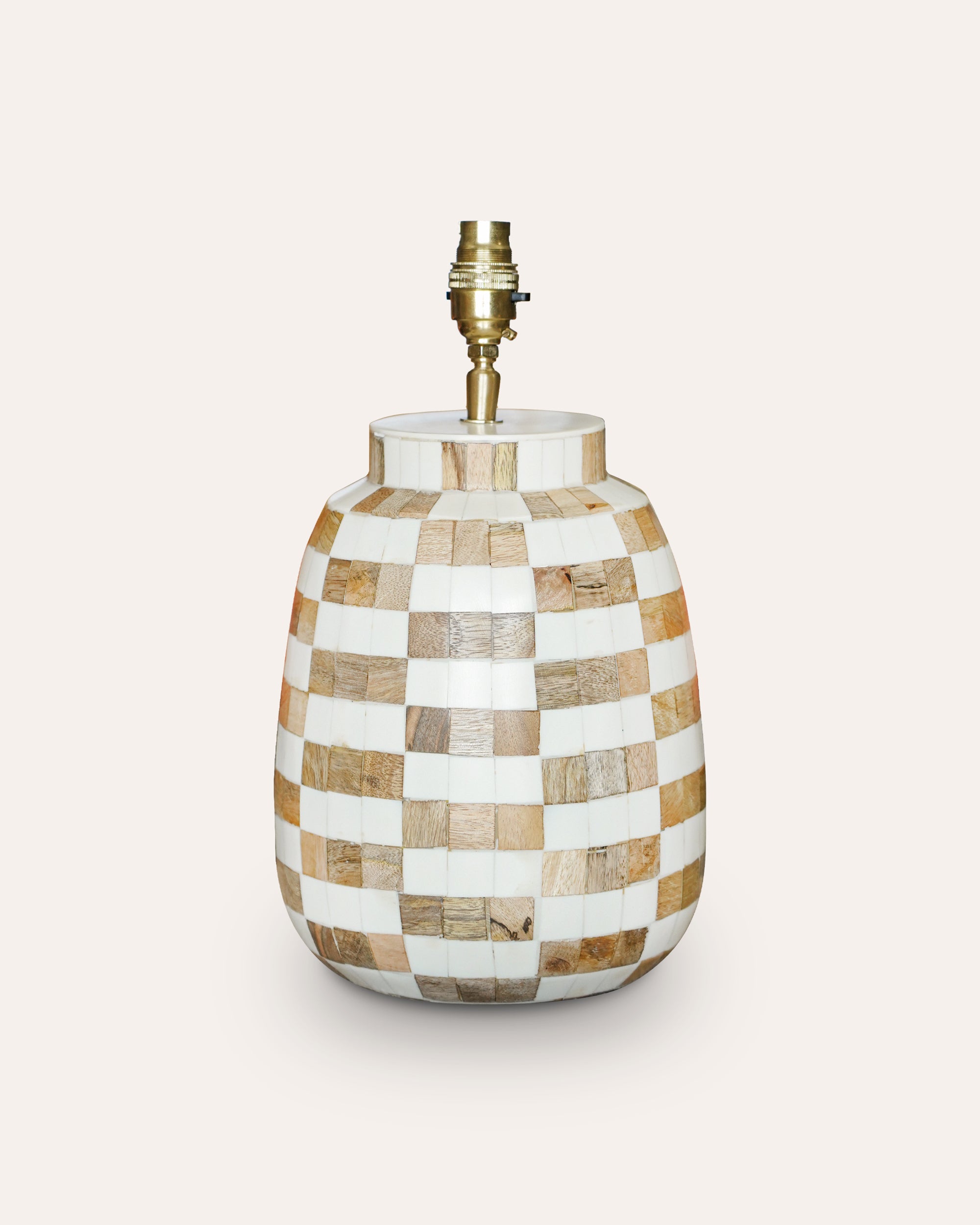 Checkered patterned lamp base on a white background