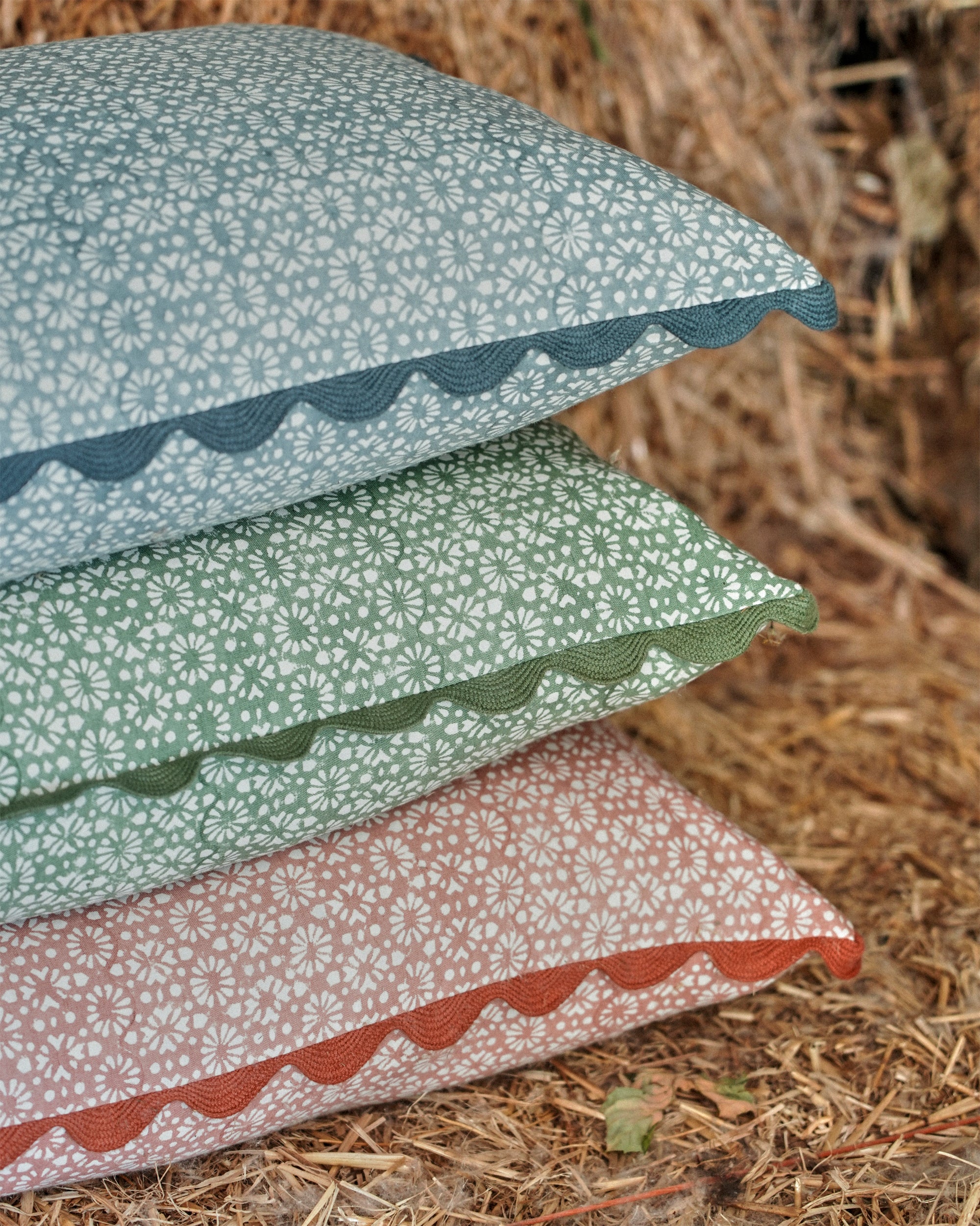 Stack of patterned pillows on a natural background