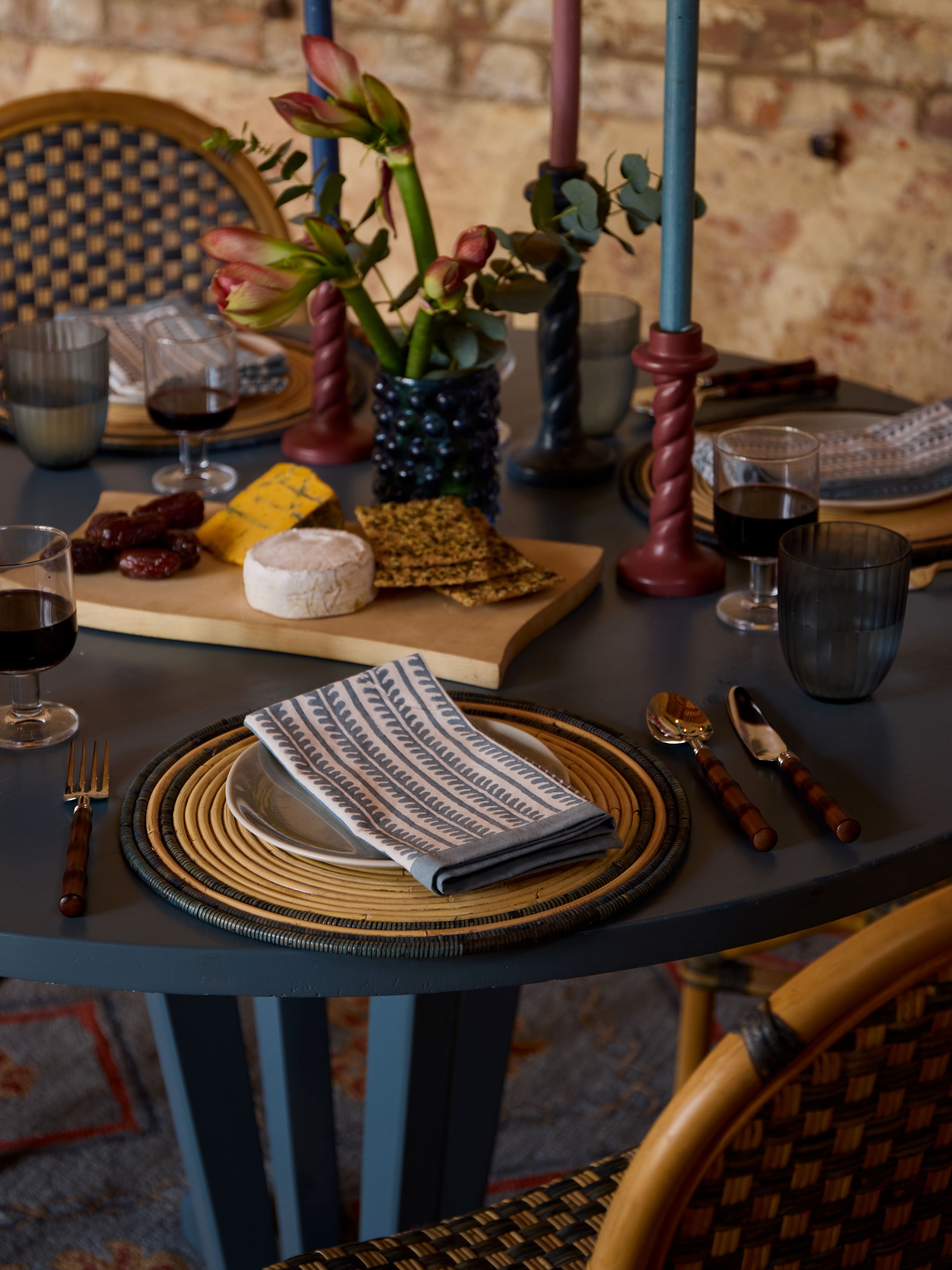 A blue table with blue bel napkins