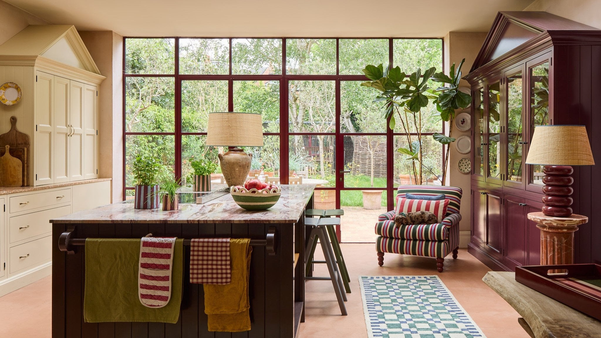 Image of a kitchen with a stripey armchair and large lamps, Birdie Fortescue X Sarah Corbett-Winder