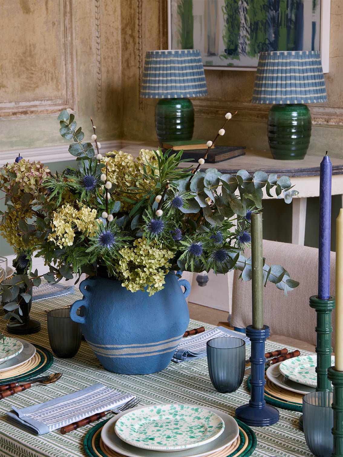 Blue and green flower vase on dining table