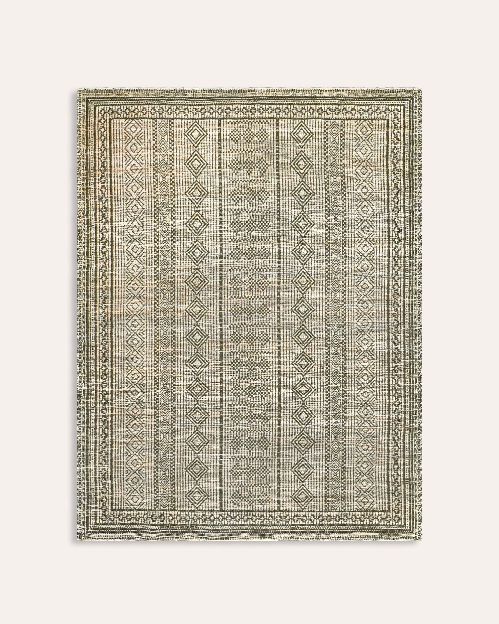 Green Moroccan jute rug with a geometric pattern - Birdie Fortescue soft furnishings