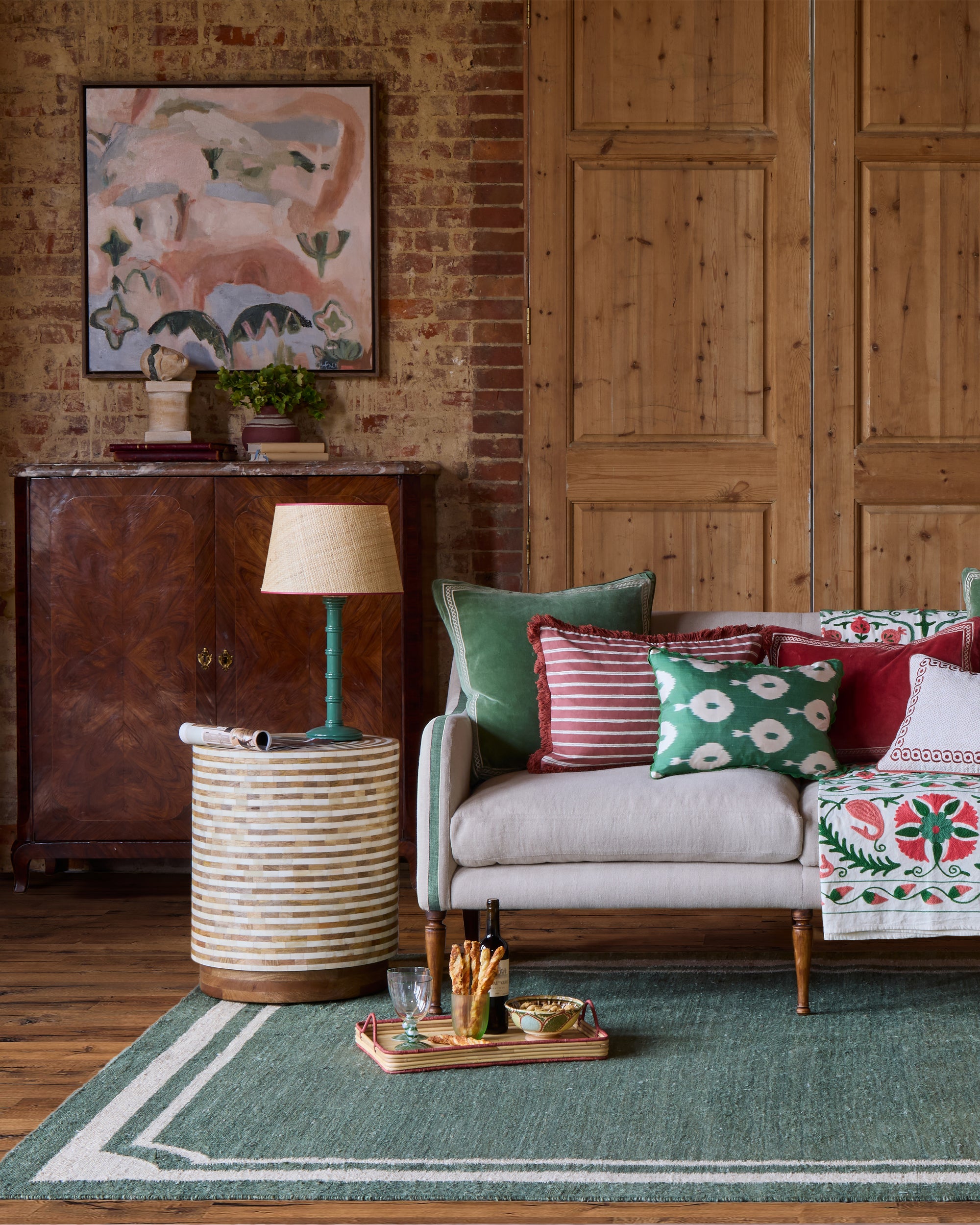 Gloss Painted Wooden Column Table Lamp with Seema Raffia Lampshade - Hedge Green, in red and green sitting room