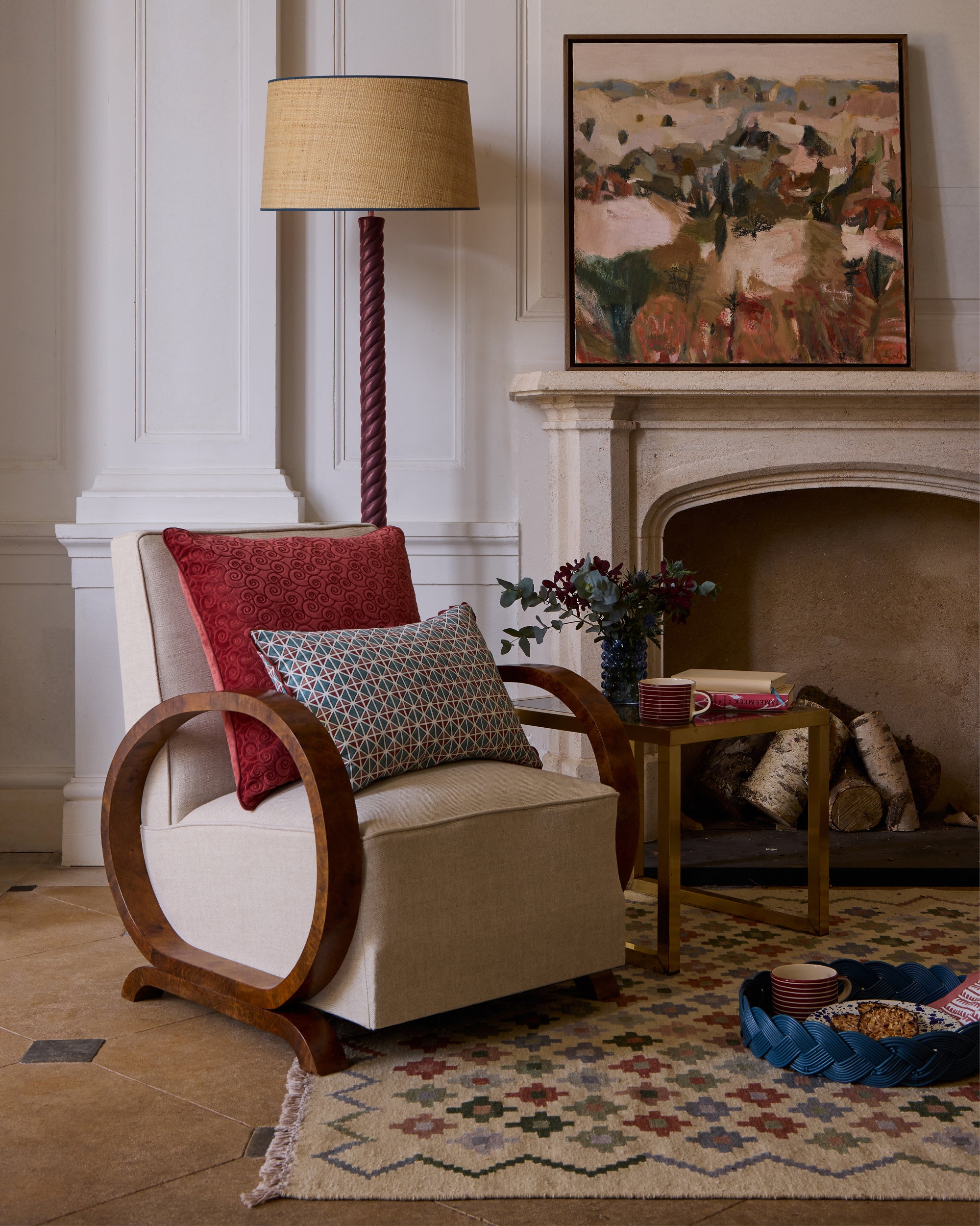 Twisted Wooden Floor Lamp - Red, next to an antique chair