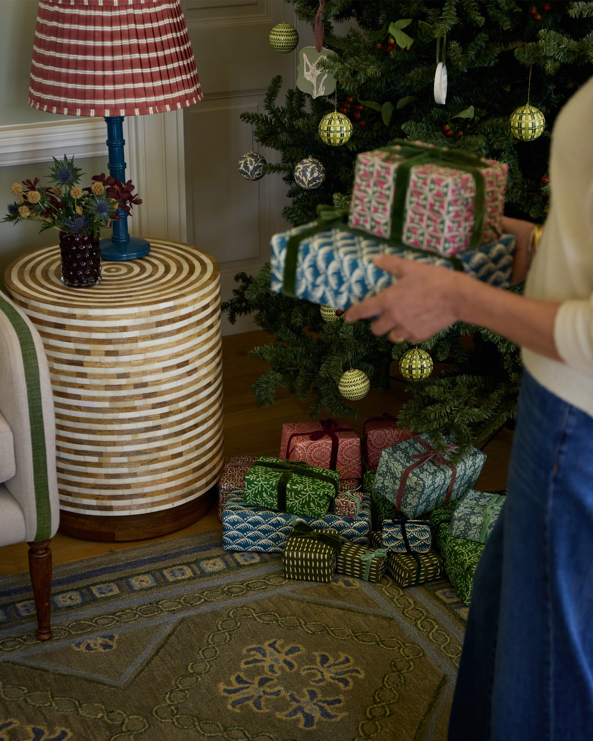 Festive Havana Inlay bone side table with a blue column lamp and red Edo Stripe lampshade