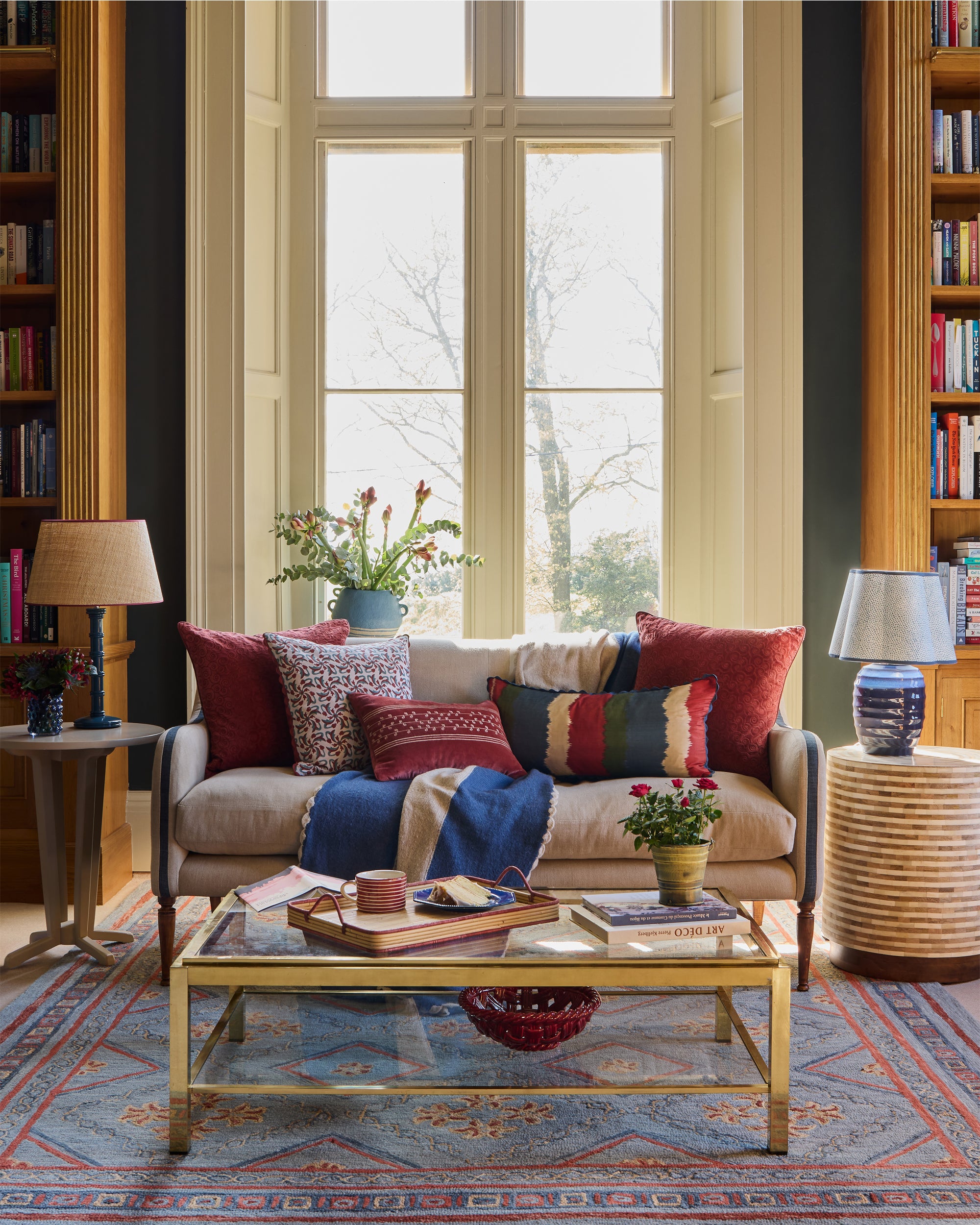 Rueda Tile Print Cushion - Red & Blue, in a red and blue sitting room