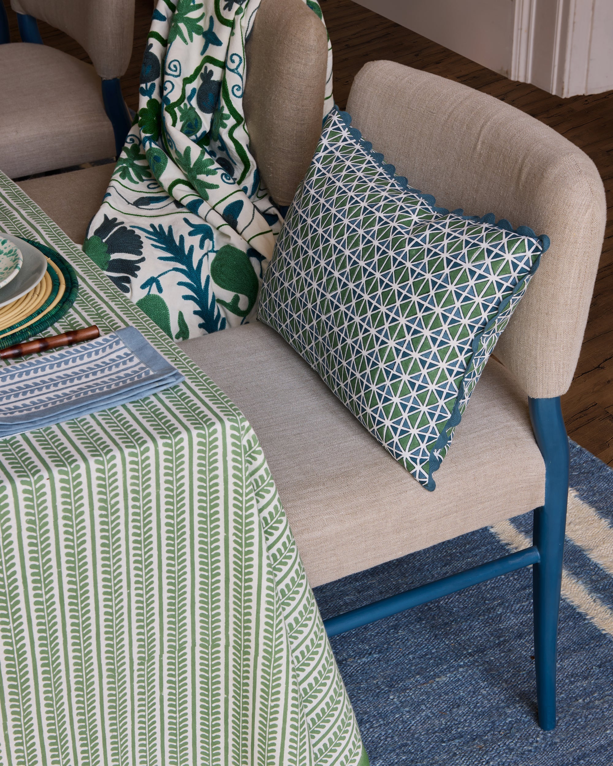 El Vedado Geometric Patterned Cushion - Green & Blue, on a Wensum Dining Chair