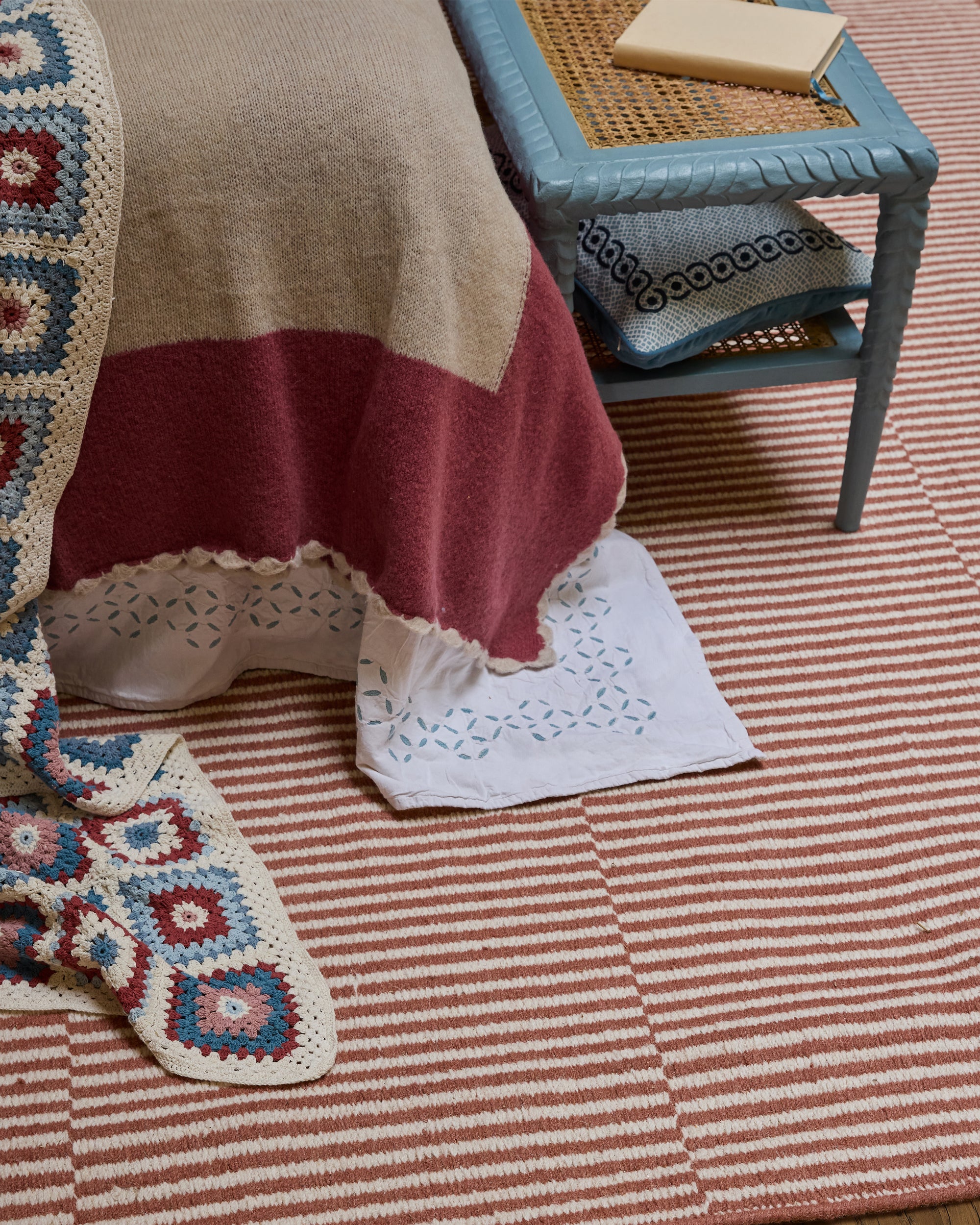 Aravali Cutwork Embroidered Cotton Reversible Bedspread - Blue, with a striped rug