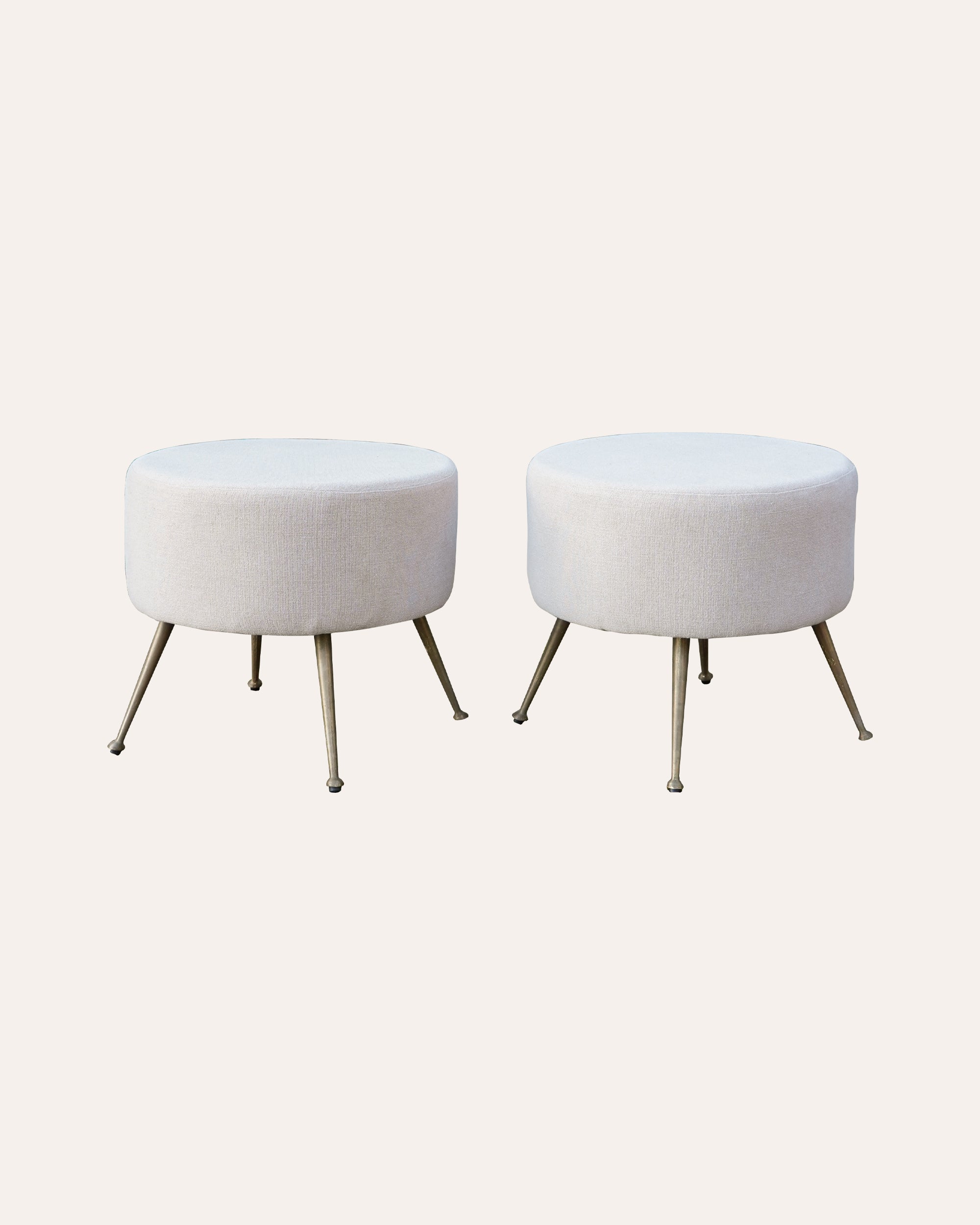 A Pair of Continental Mid Century Upholstered Circular Stools with Brass Legs