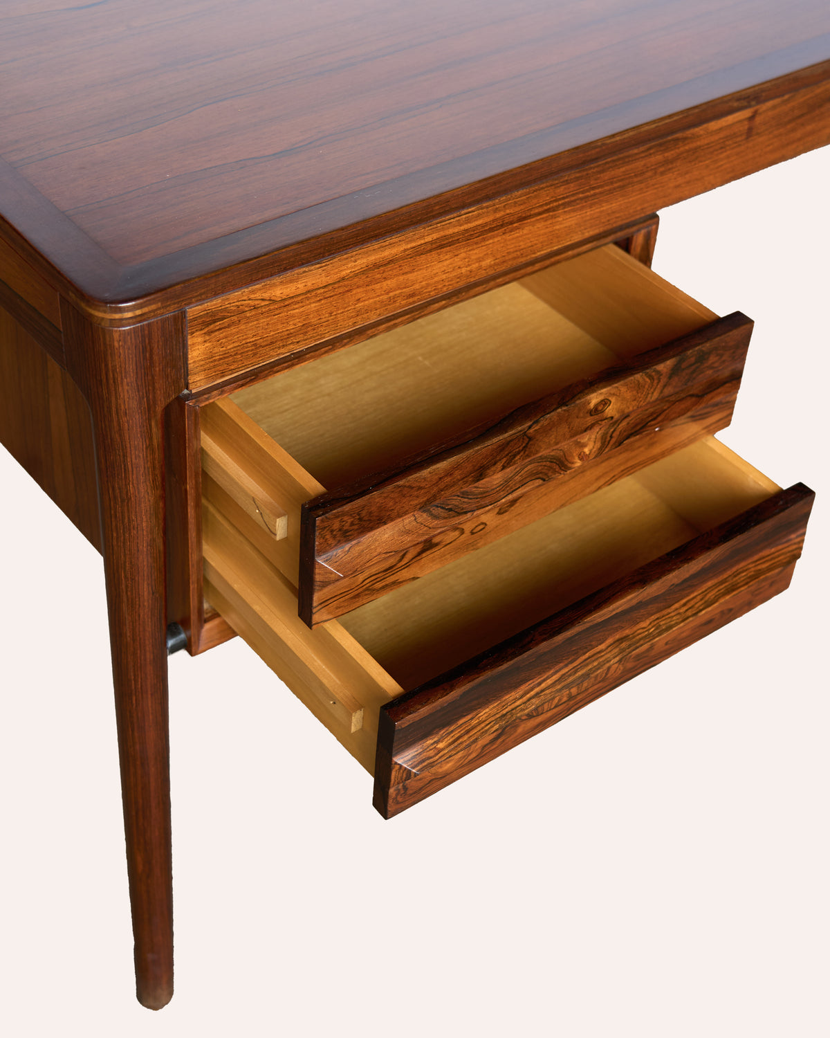 A generous Italian 1970's rosewood kneehole desk