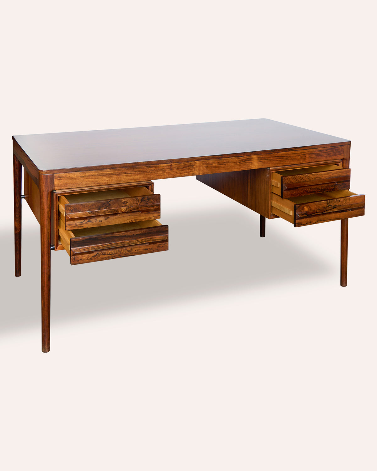 A generous Italian 1970's rosewood kneehole desk