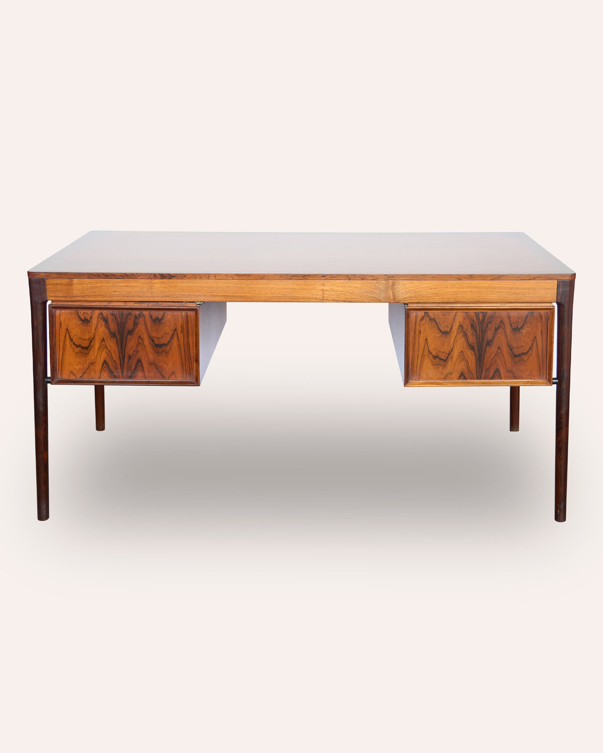 A generous Italian 1970's rosewood kneehole desk