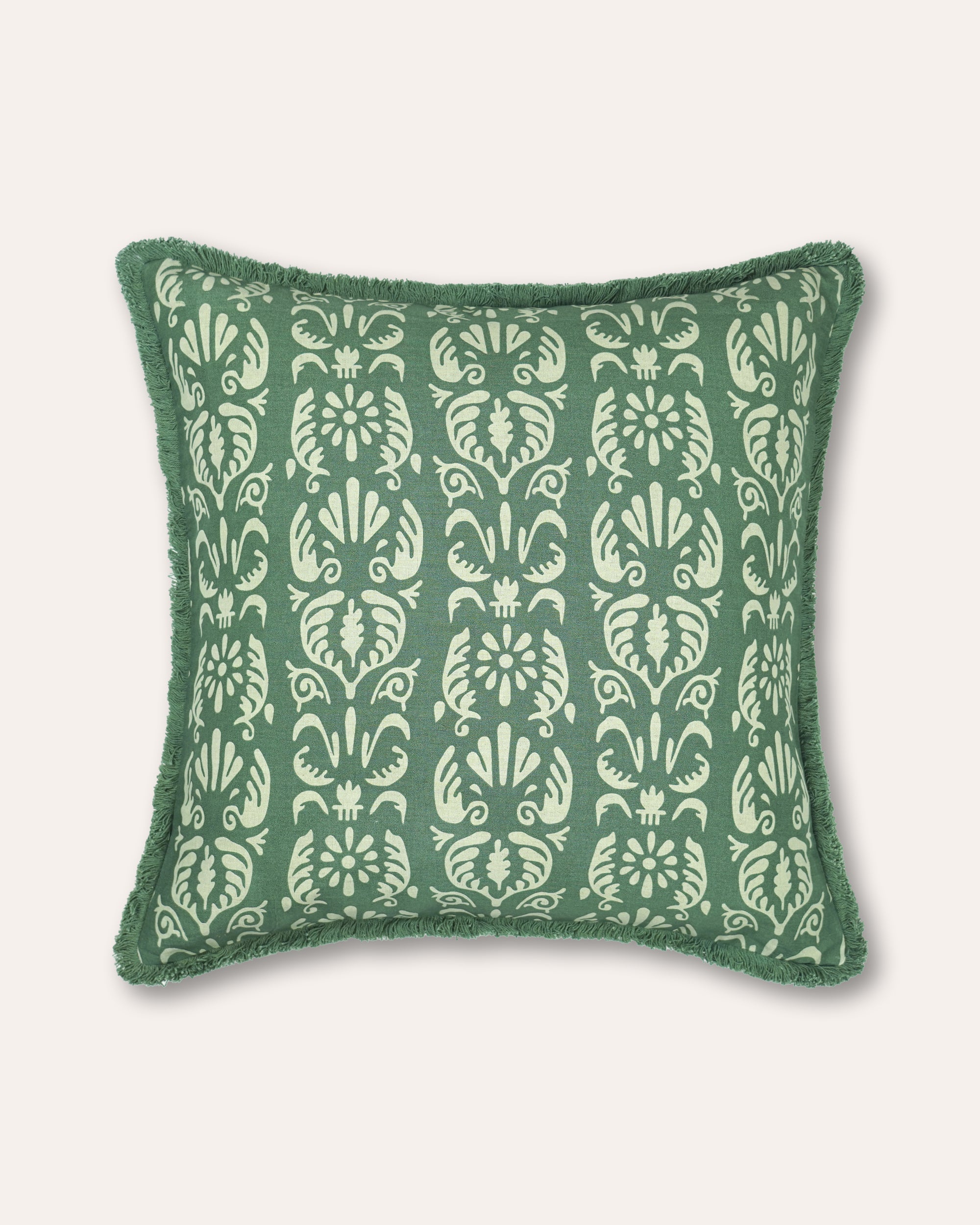 A square throw pillow featuring a green and cream damask pattern with a fringed edge, shown against a light beige background.