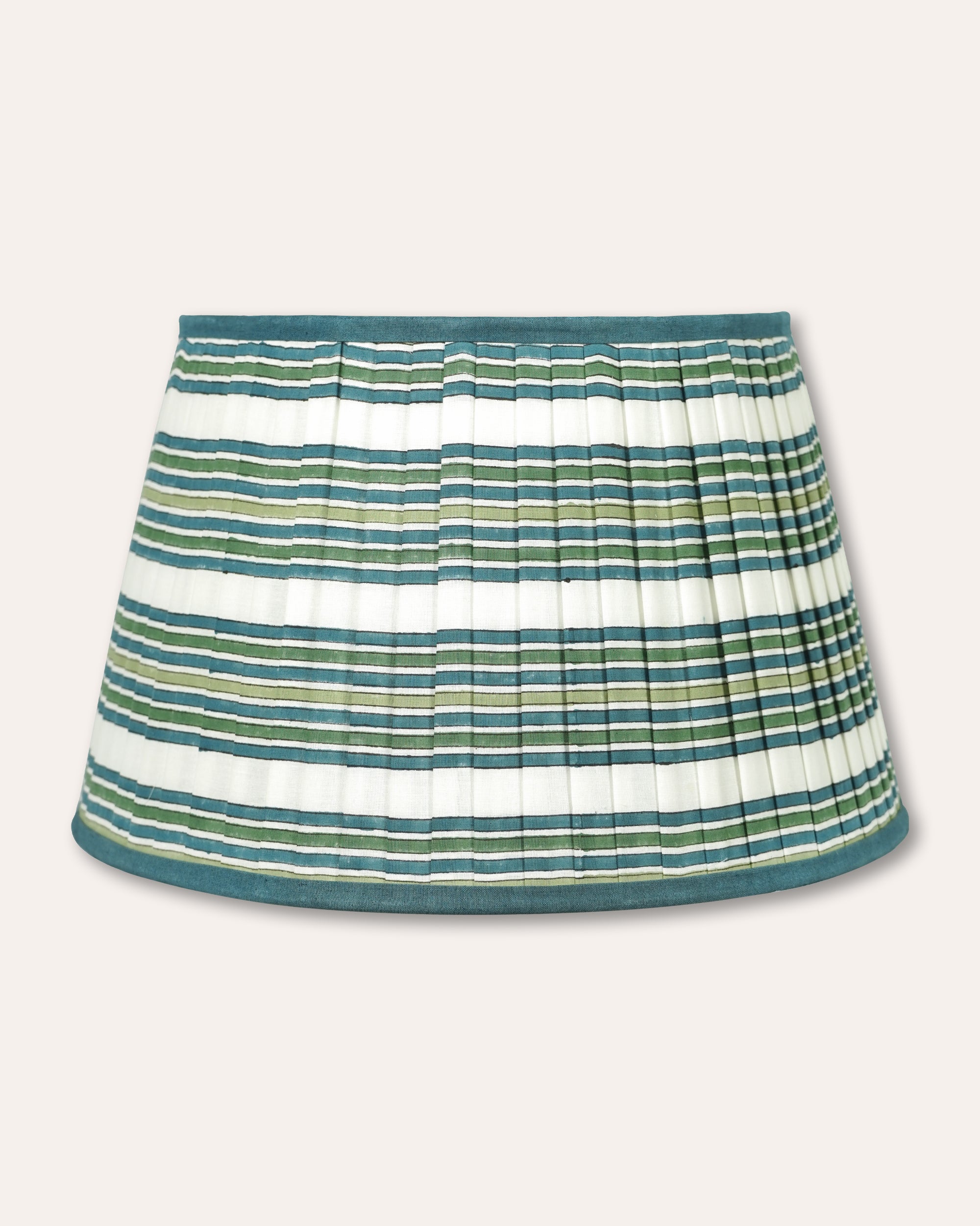 A pleated lampshade with horizontal stripes in teal green, olive green, and white, featuring a solid teal waistband and hem, shown against a light beige background.