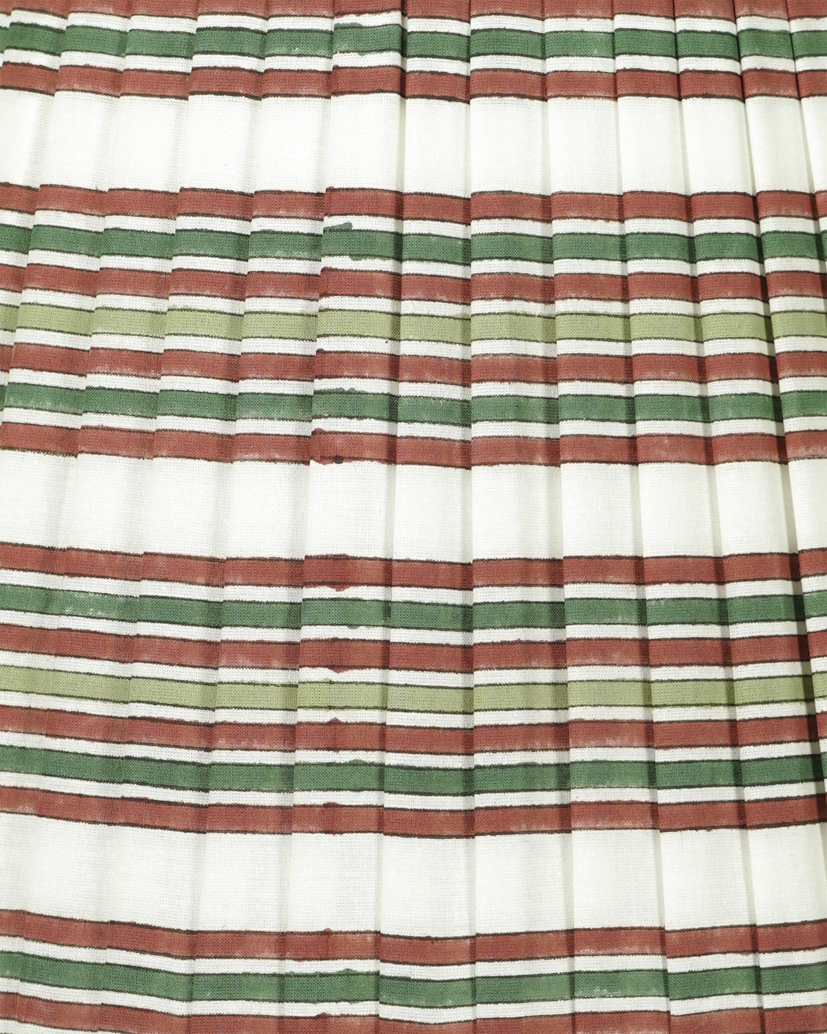 A close-up of a pleated fabric with horizontal stripes in terracotta red, sage green, olive green, and white.