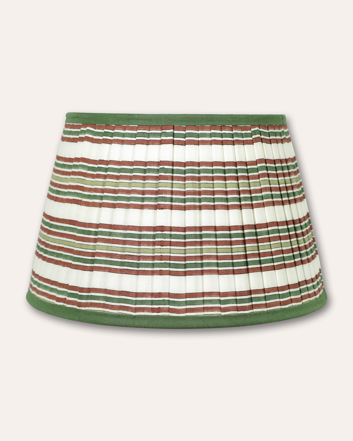 A pleated fabric lampshade with horizontal stripes in green, brown, and white, finished with solid green trim at the waistband and hem, shown against a light beige background.