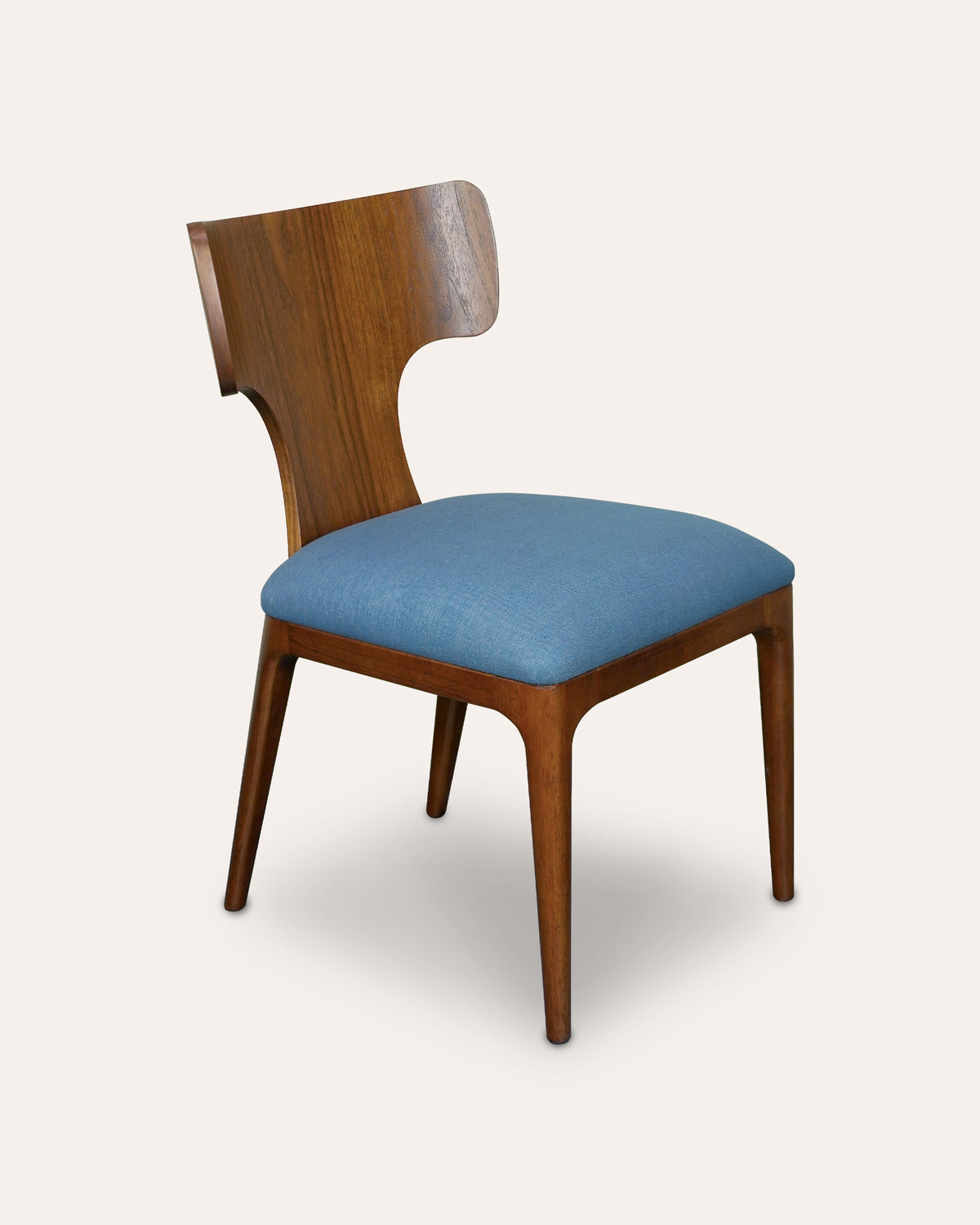 A wooden dining chair with a curved backrest, medium brown wood frame, and a light blue upholstered seat cushion, shown against a solid off-white background.