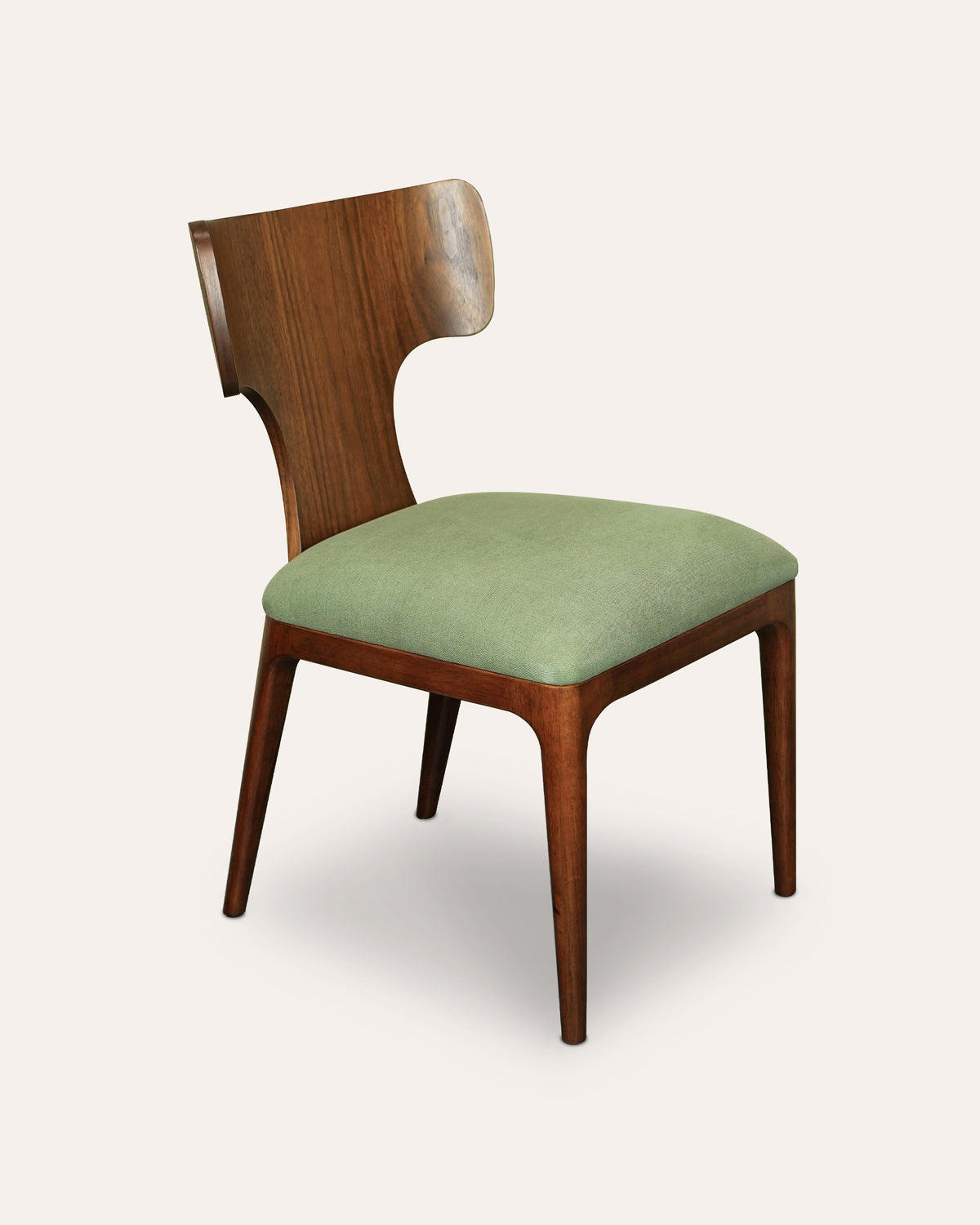 A wooden dining chair with a curved backrest, medium brown wood frame, and a light sage green upholstered seat cushion, shown against a solid off-white background.