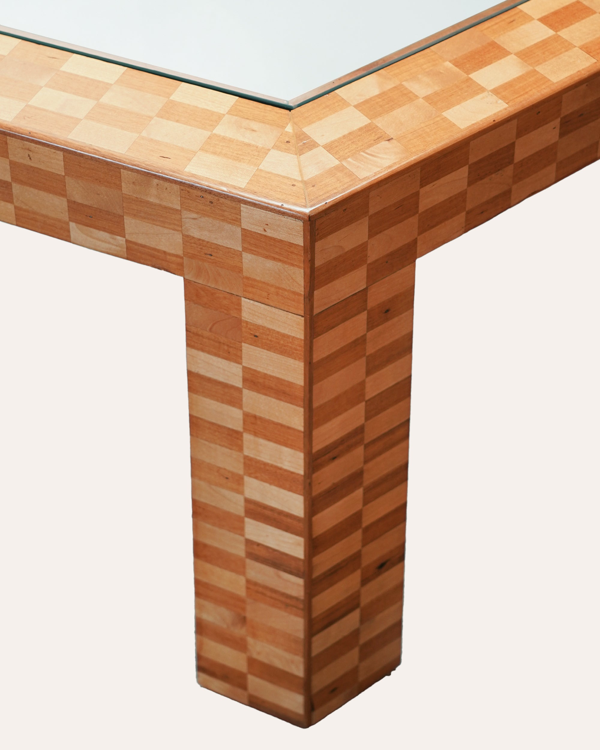 Wooden table with a checkered pattern on a white background