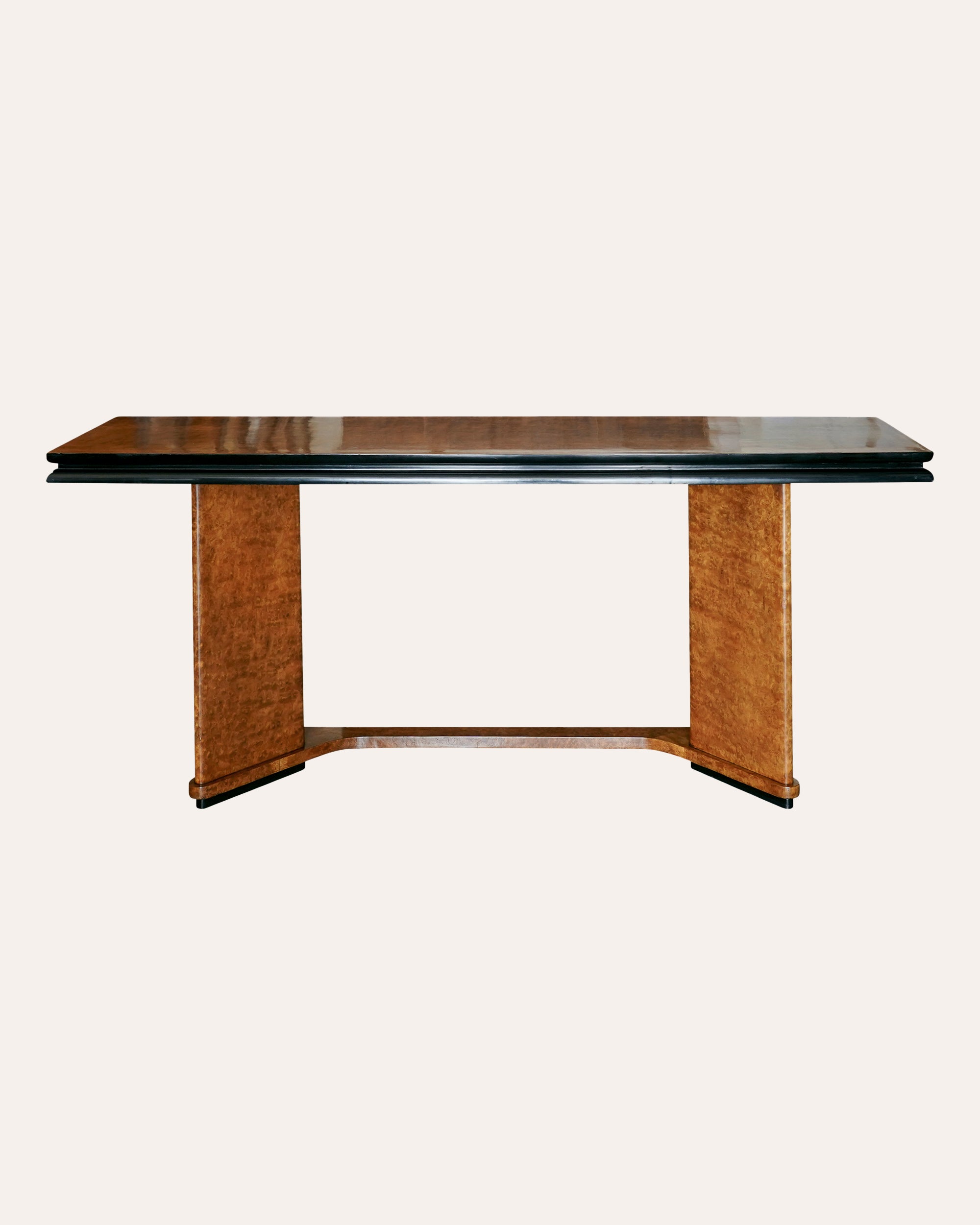 Dining table with dark top and light brown base on a white background