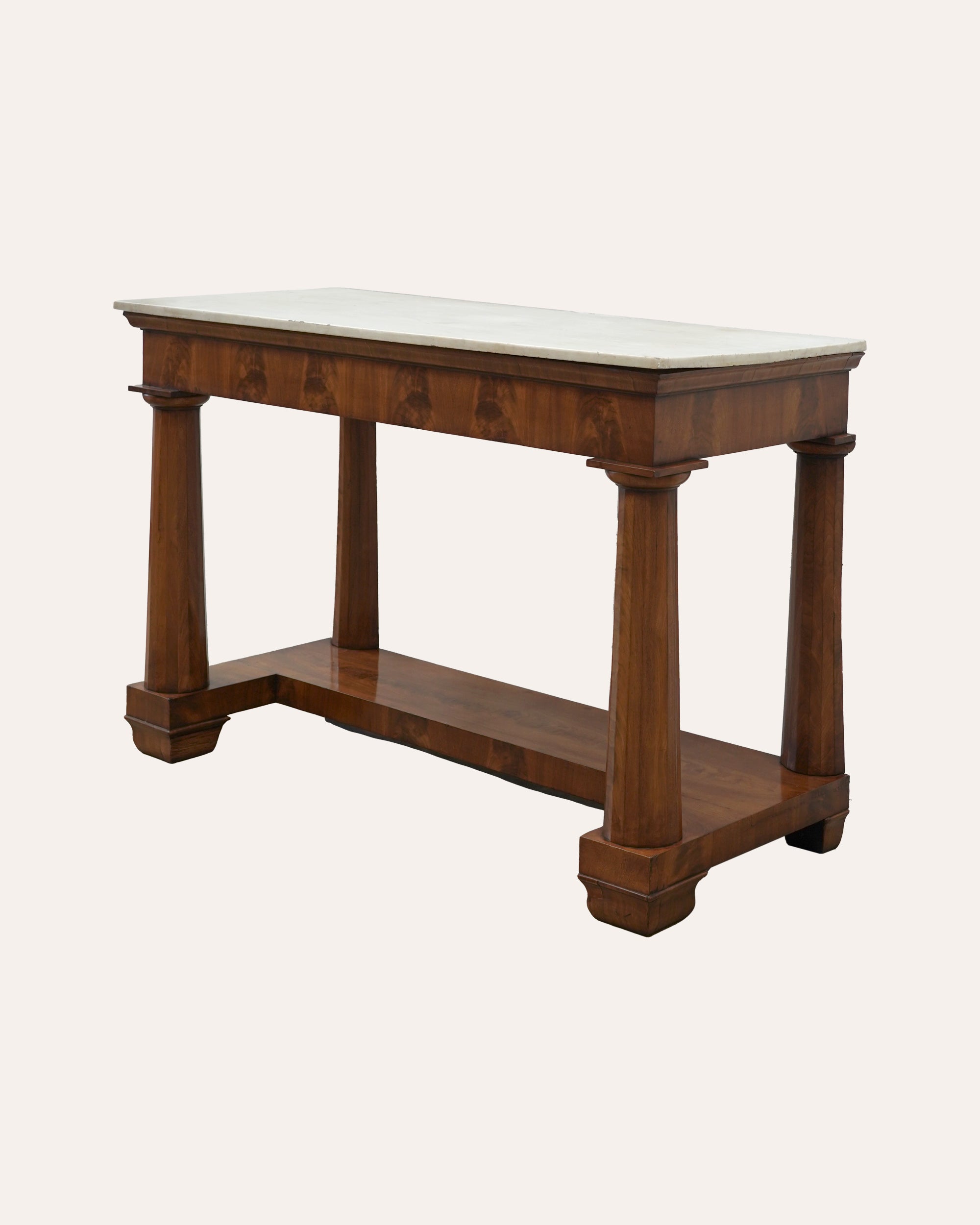 Angled image to show the side of the antique mahogany side table, with marble top