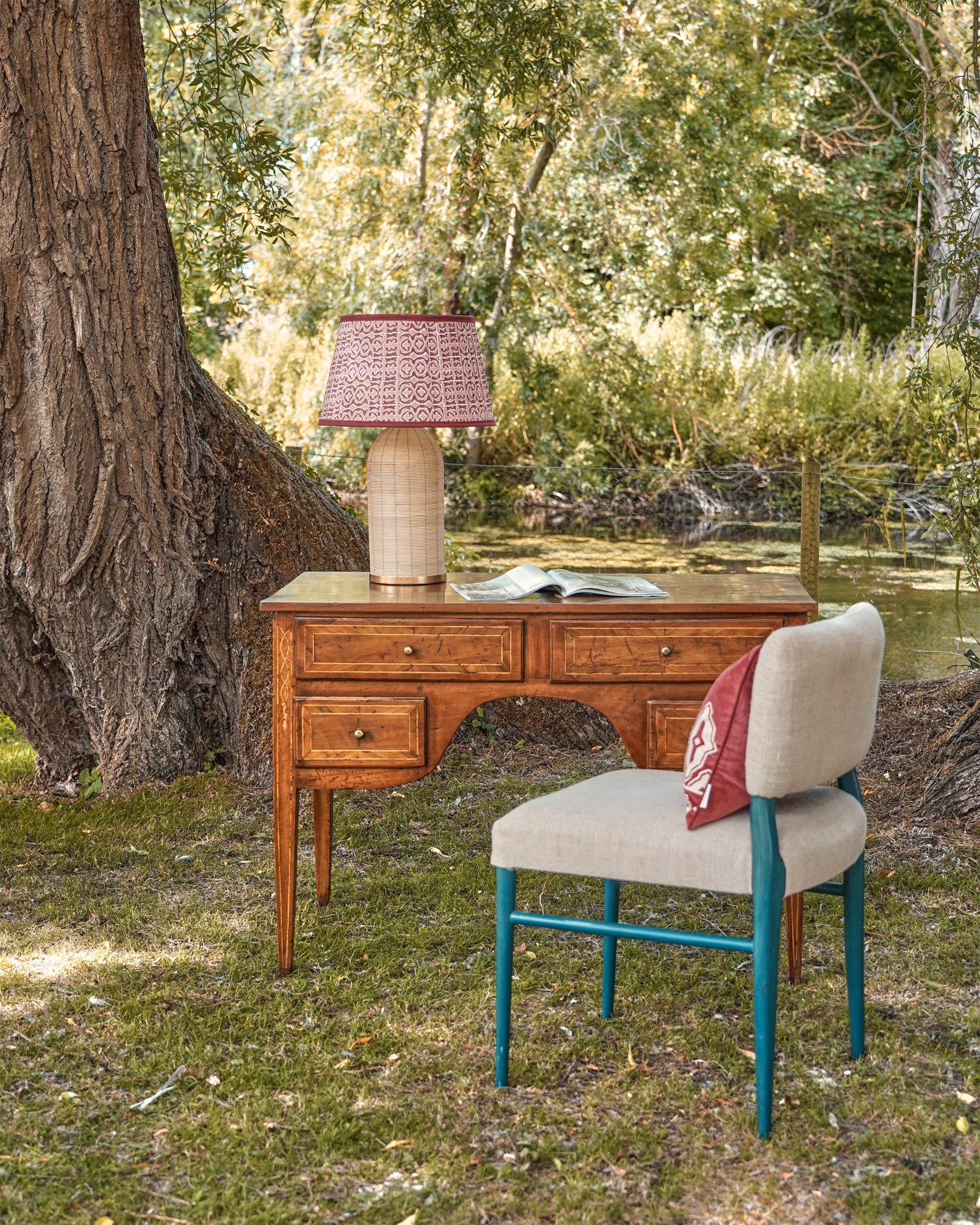 Outdoor office setting featuring the Wensum chair and antique desk