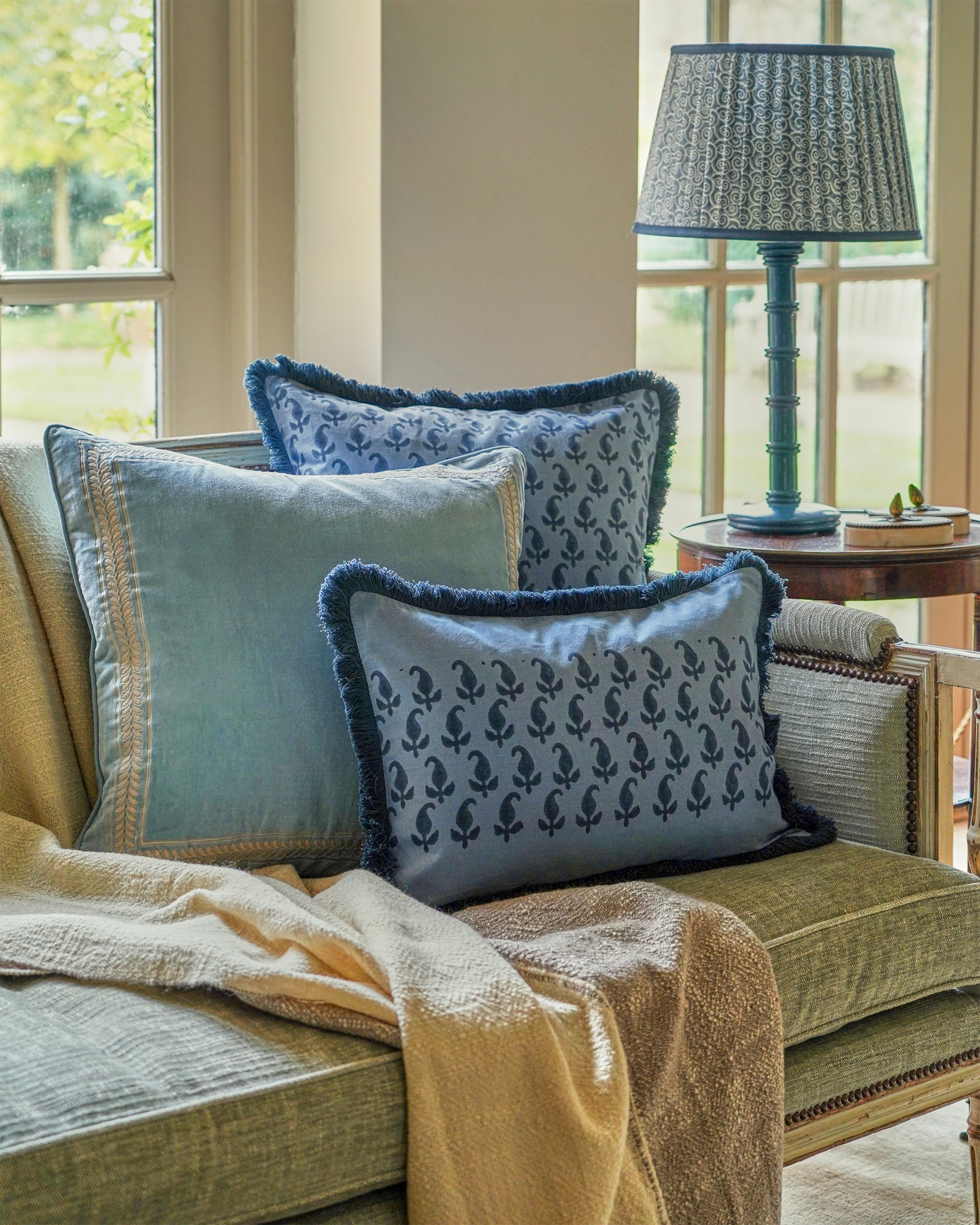 blue paisley cushions with taupe throw