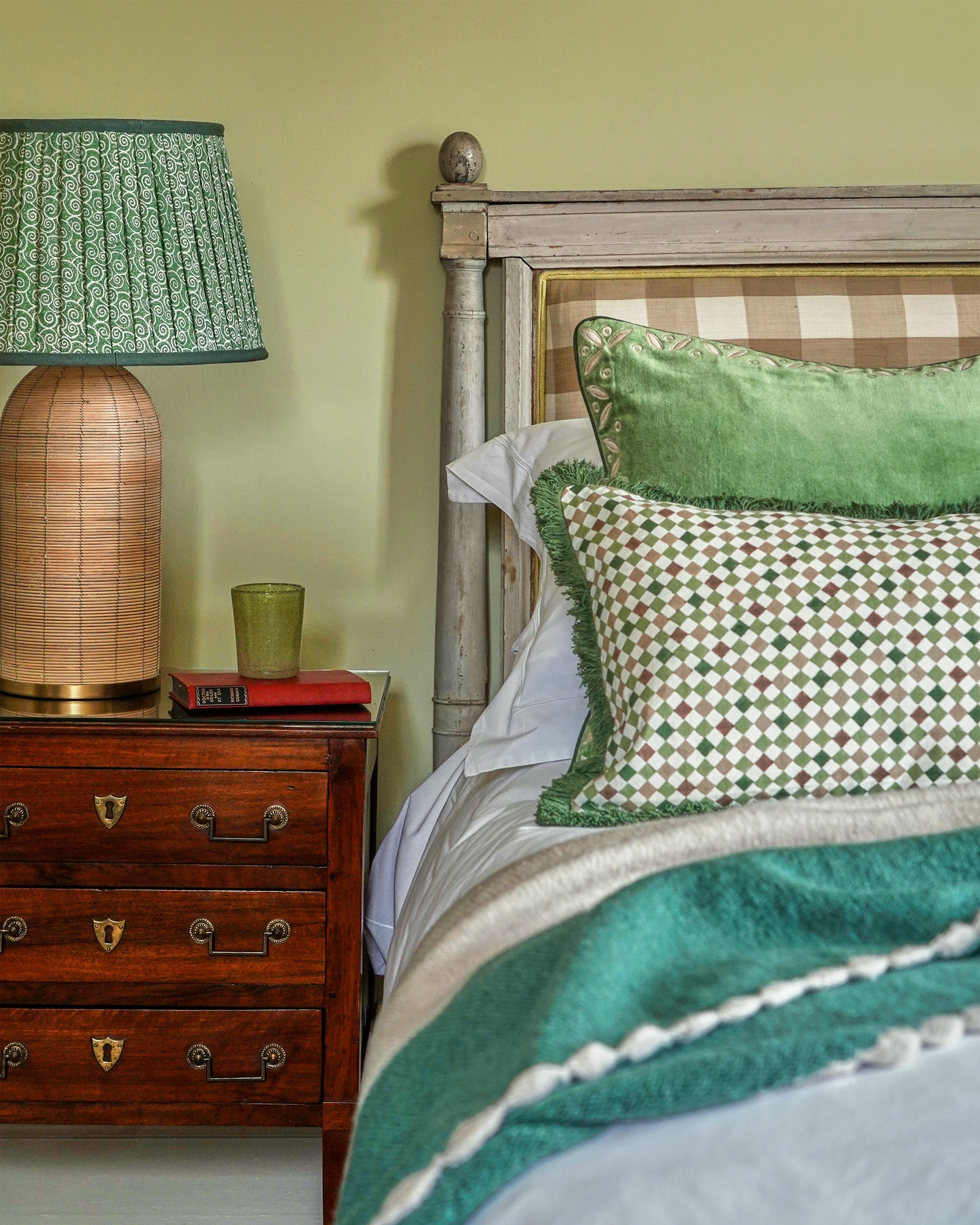 green bedroom with cushions