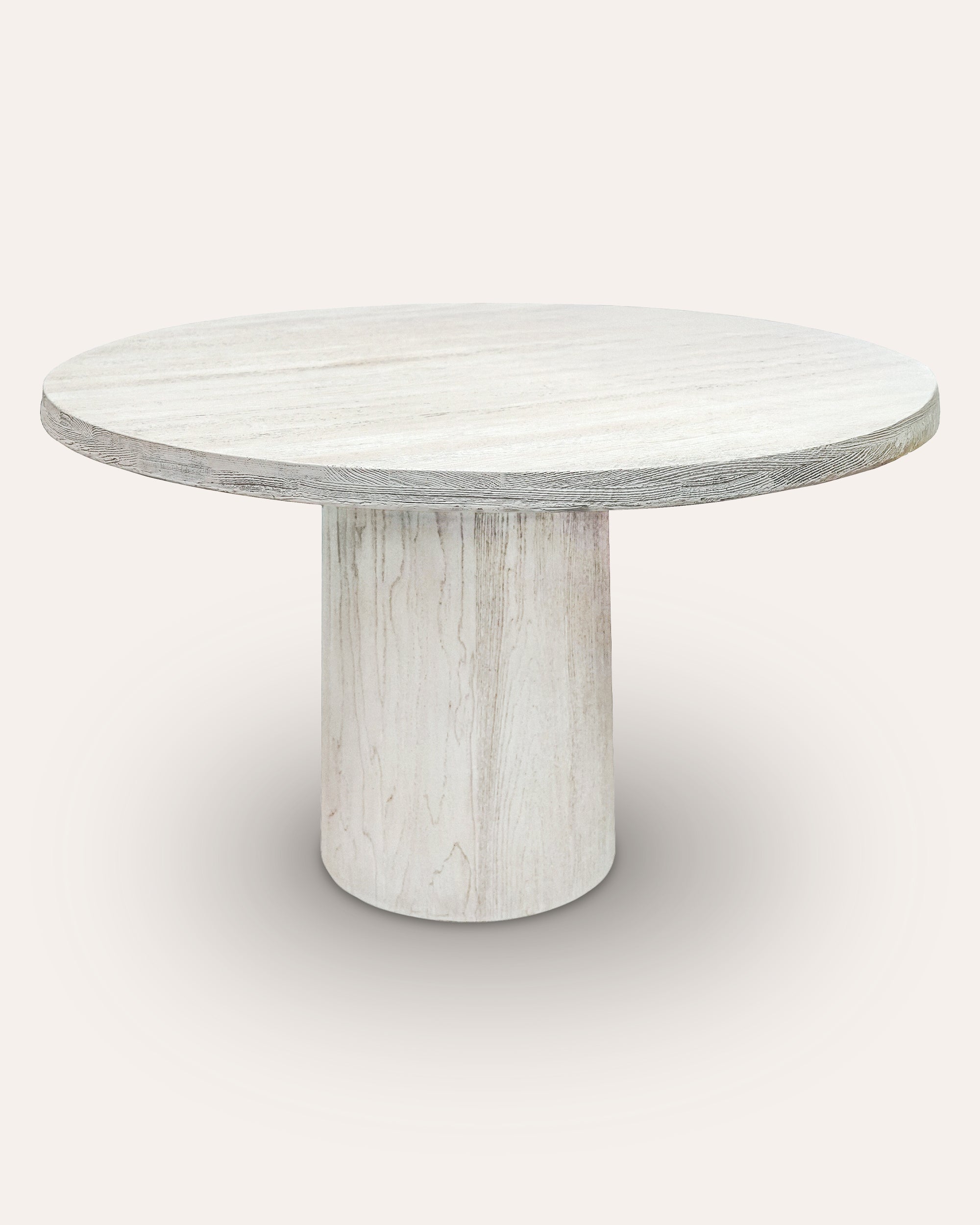 Round white dining table with a light grey and white pattern on a white background