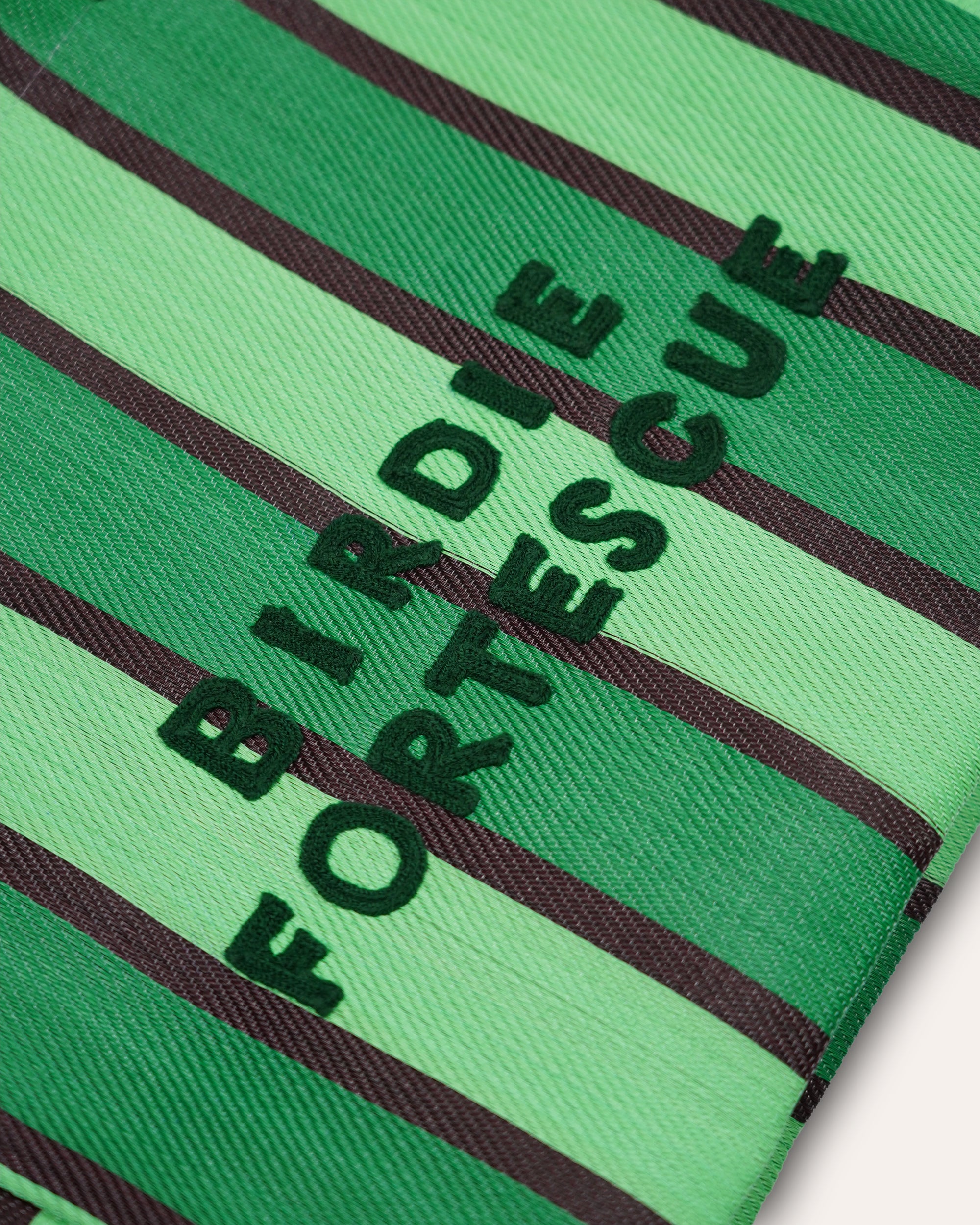Green and black striped fabric with 'Birdie Fortescue' branding.