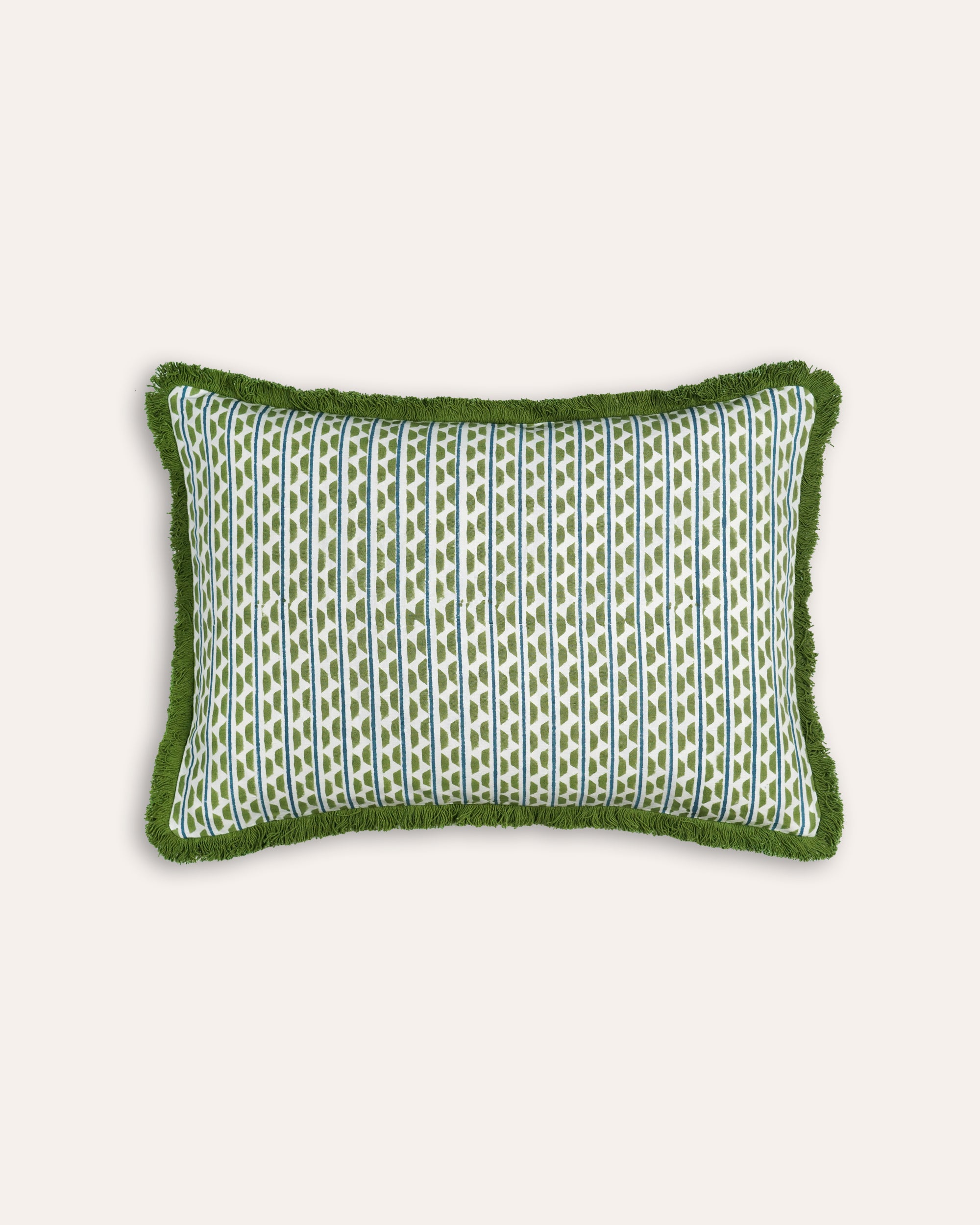 Green patterned cushion on a white background