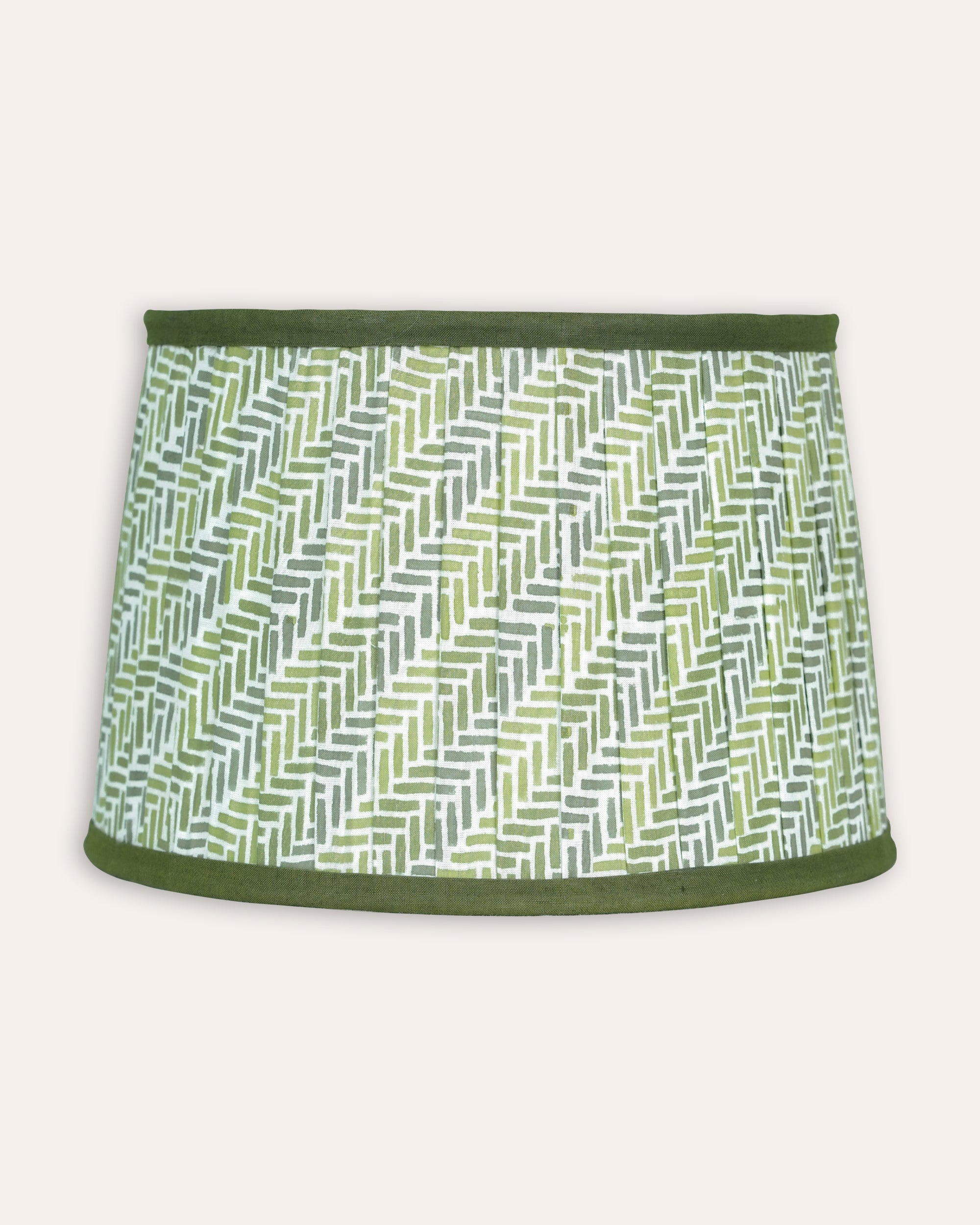 Green and white patterned lampshade on a white background