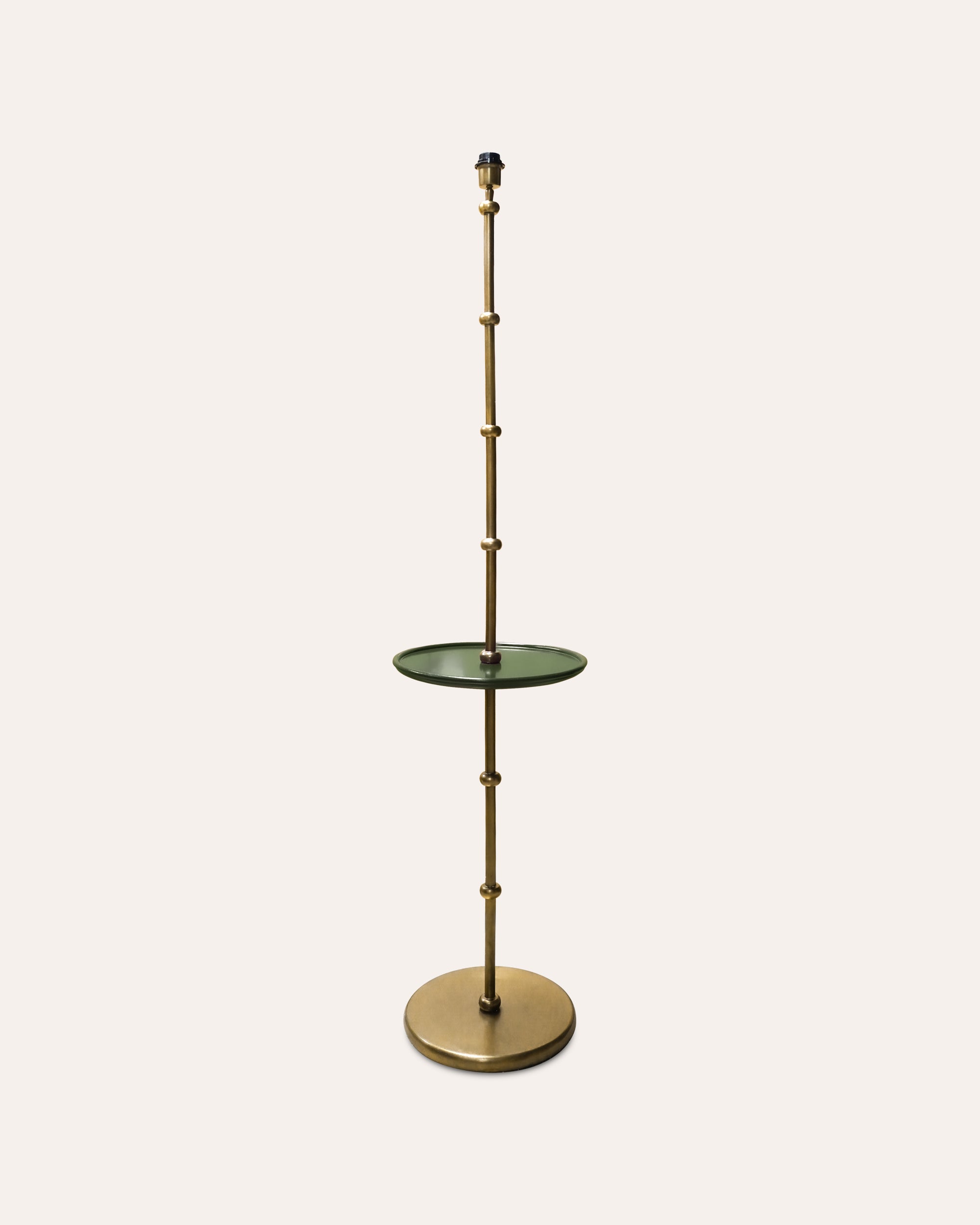 Decorative floor lamp with a round base and cylindrical design on a white background