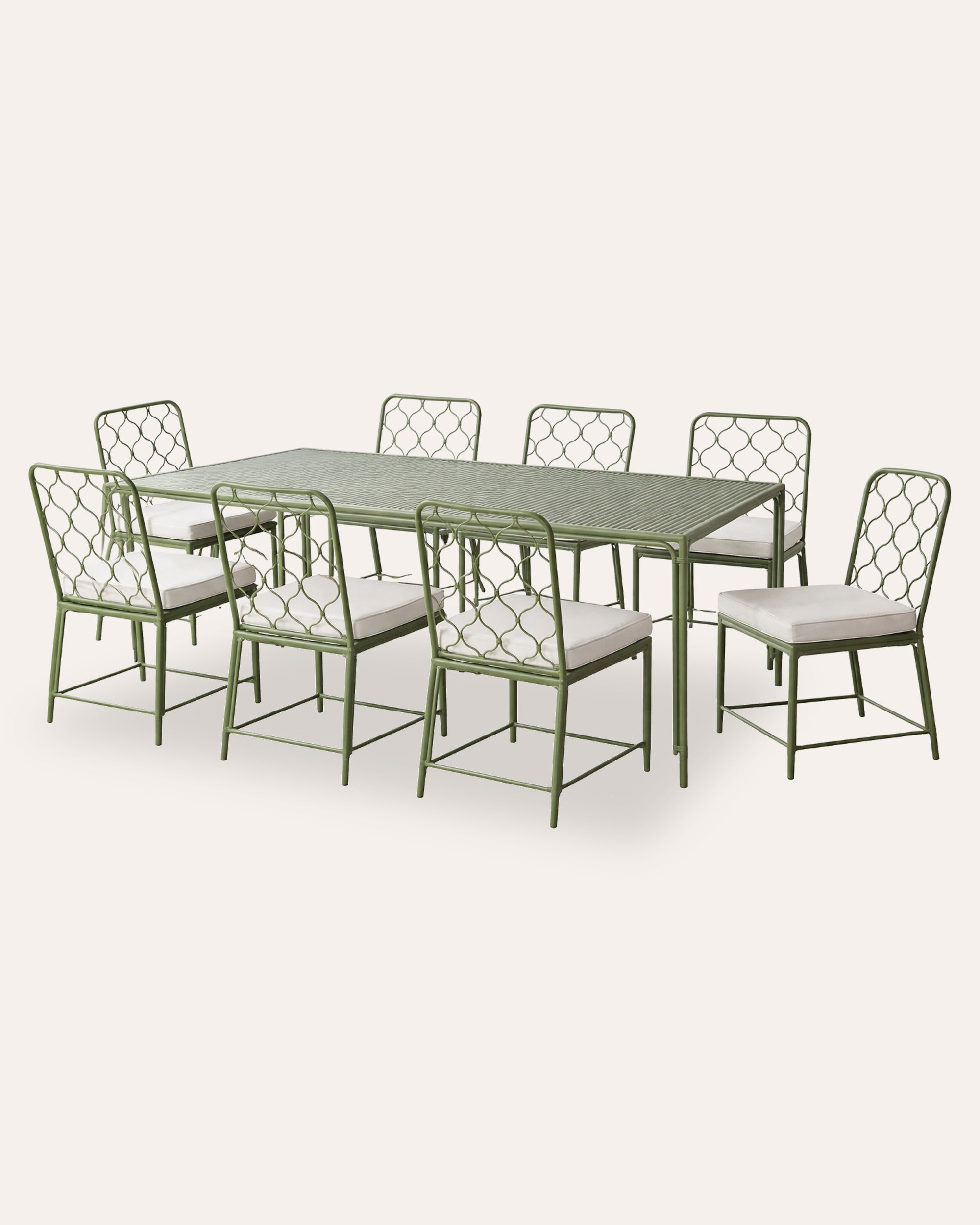 Green metal dining table with six matching chairs on a white background