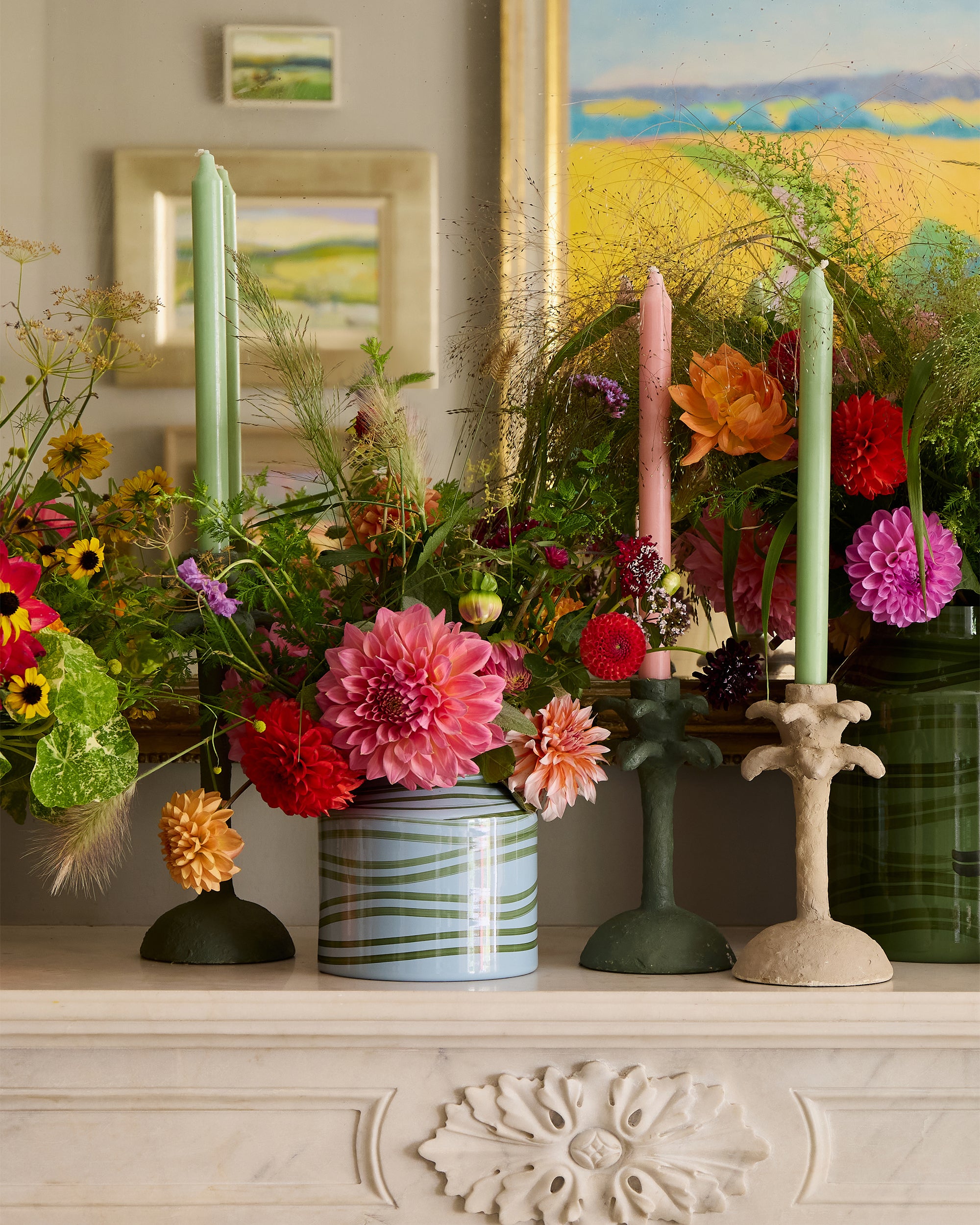 Summer fireplace arrangement featuring the light blue and green maypole vase with the palm tree candlesticks