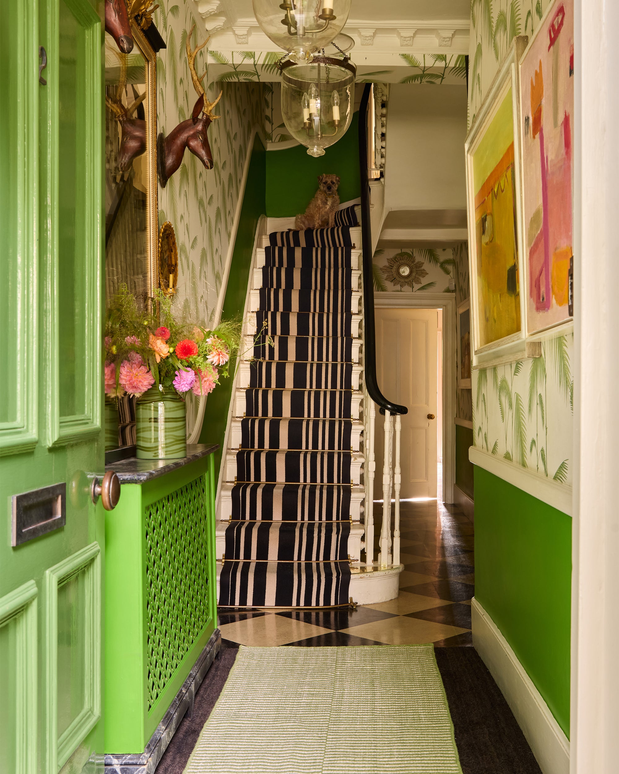 Lifestyle image of Butter Wakefields hallway featuring the green 'Striped Panel Runner' and 'Large Green Maypole Vase'