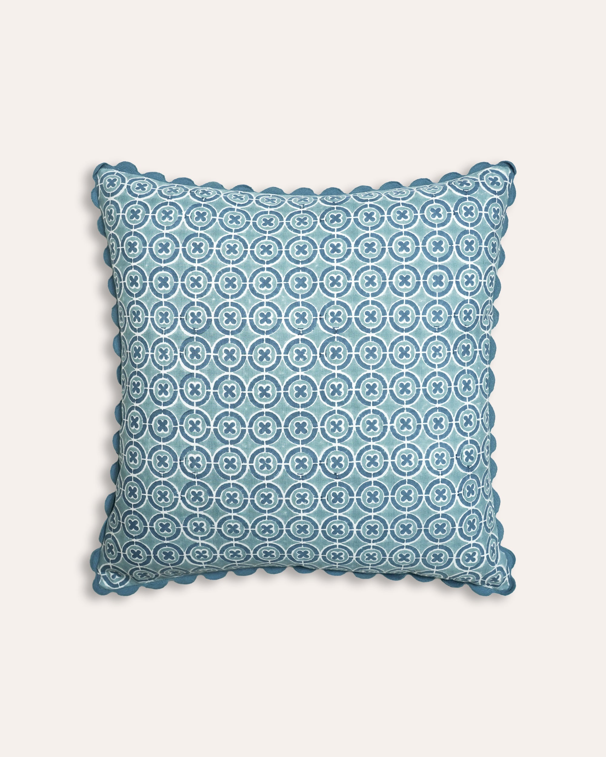 Blue geometric square cushion with ricrac