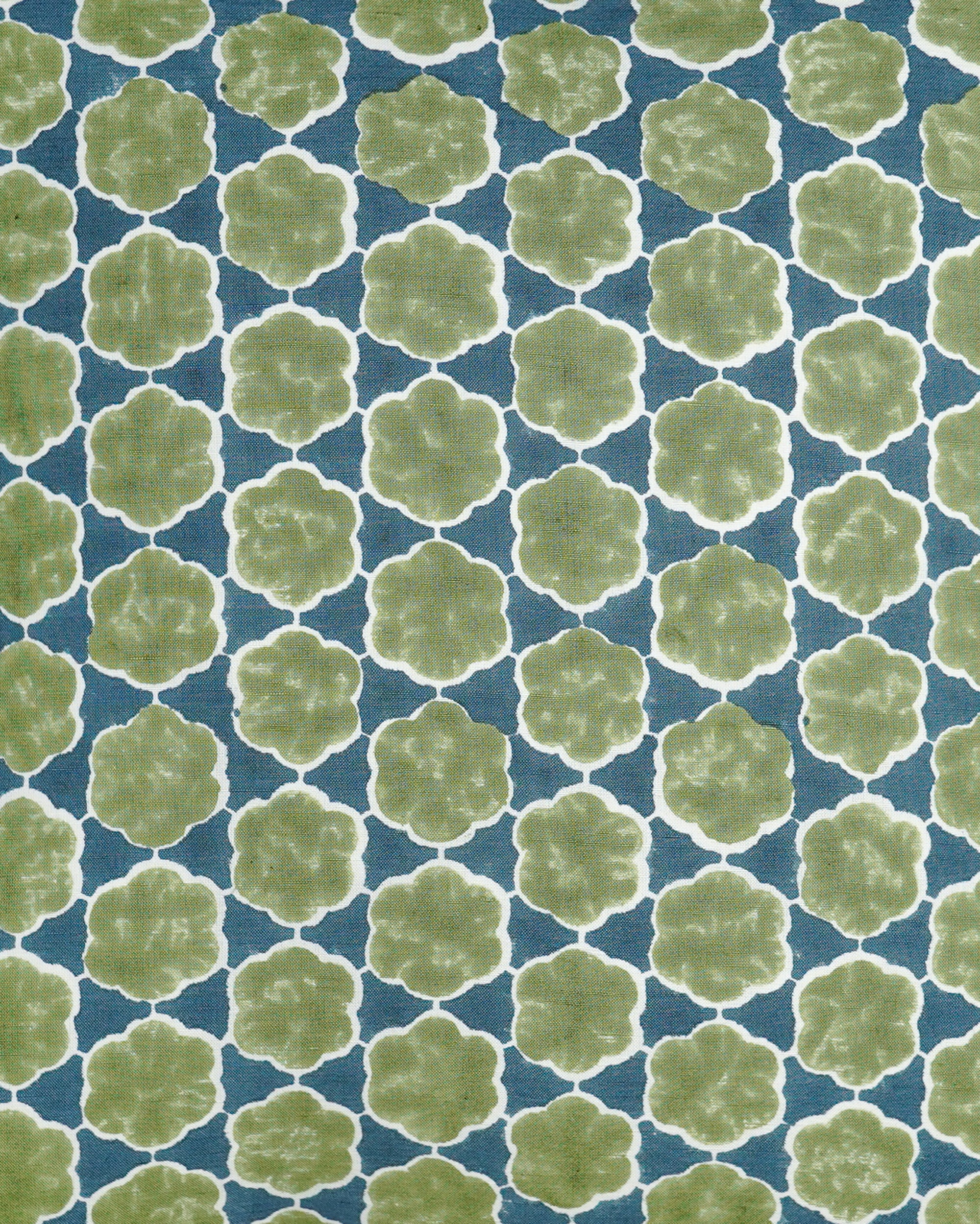 Close up detail image of the blue and green block printed cushion
