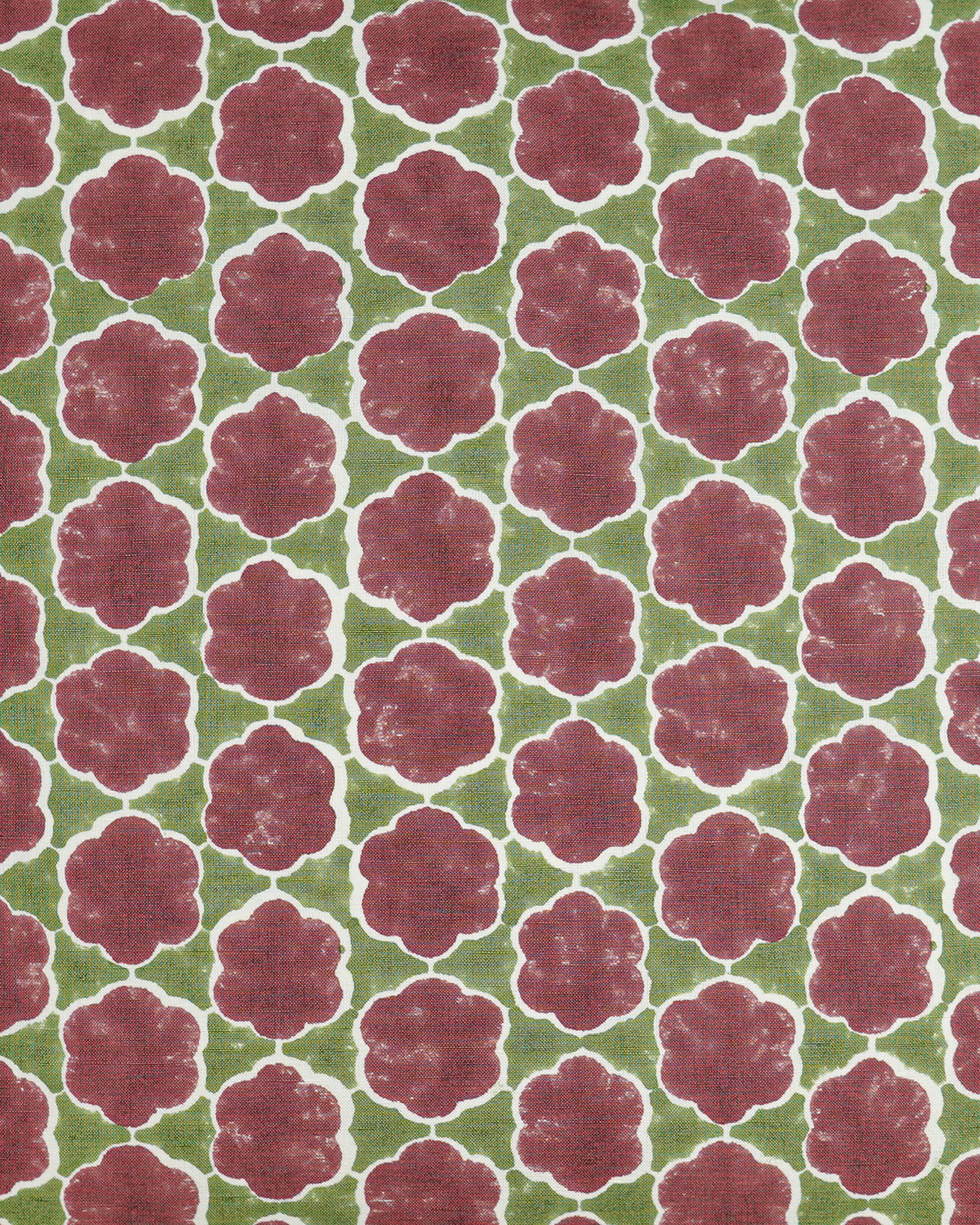 Close up detail image of the red and green block printed cushion