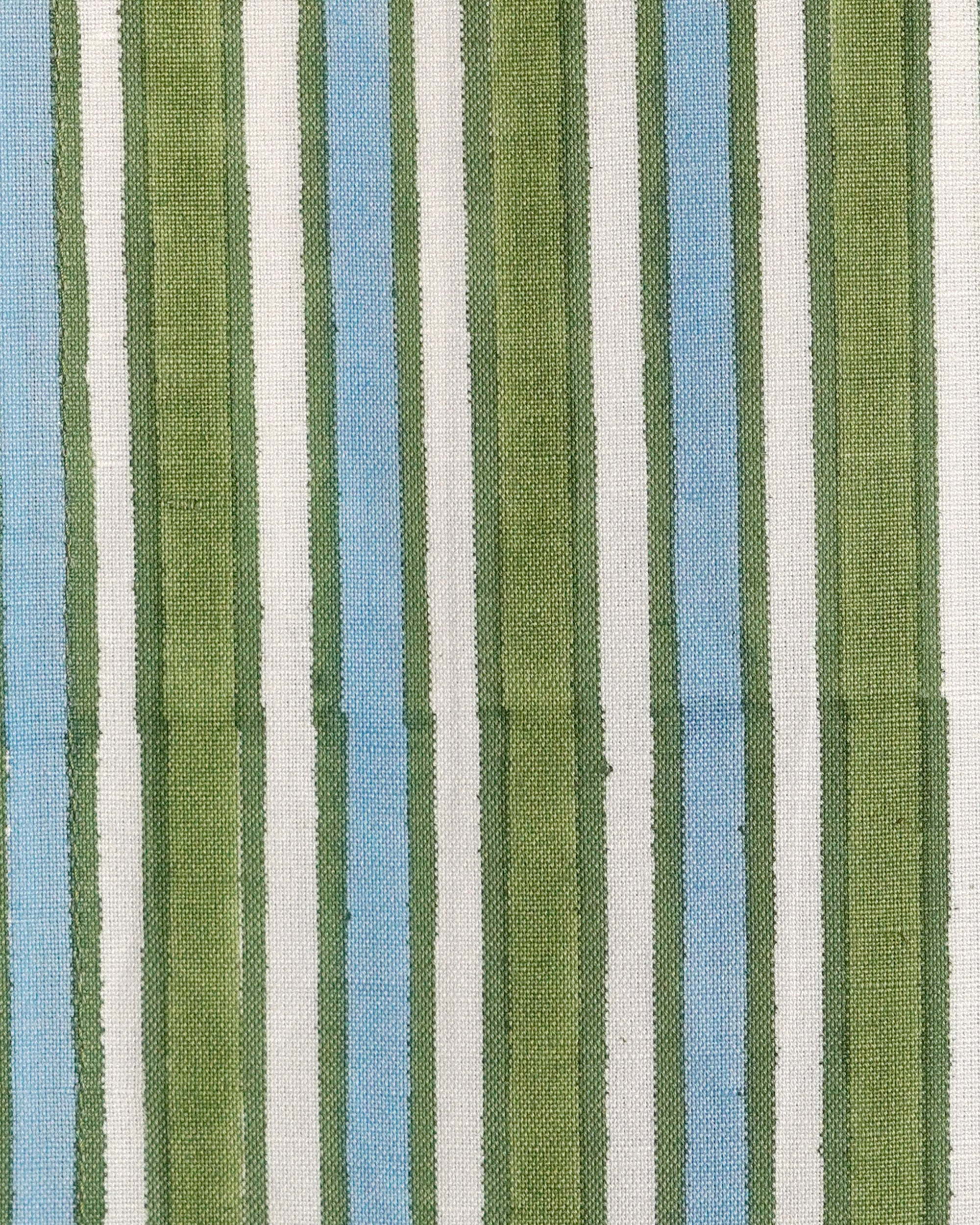 Close up detail image of the blue and green garden striped napkin