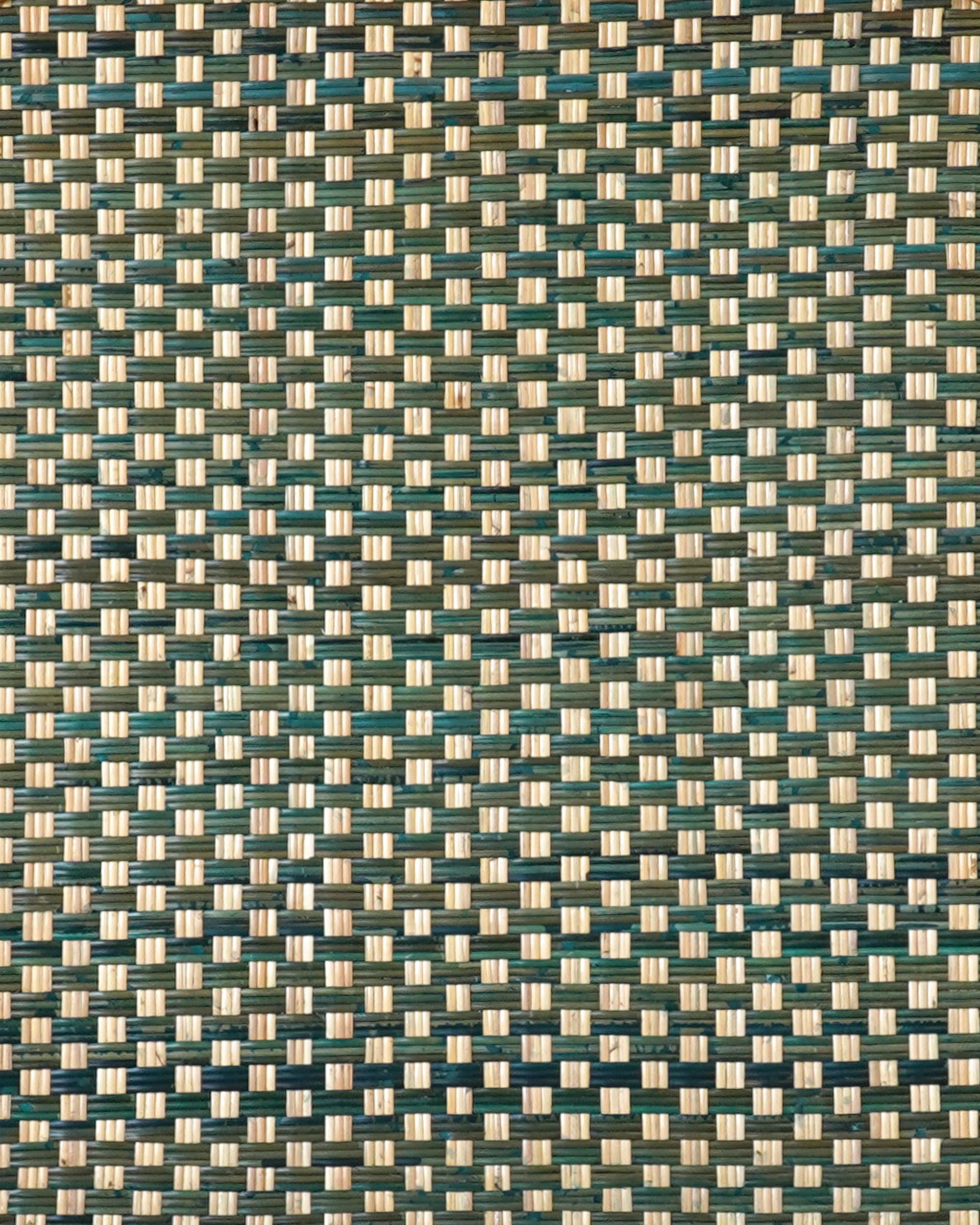Close up detail of the woven pattern on the green rattan headboard