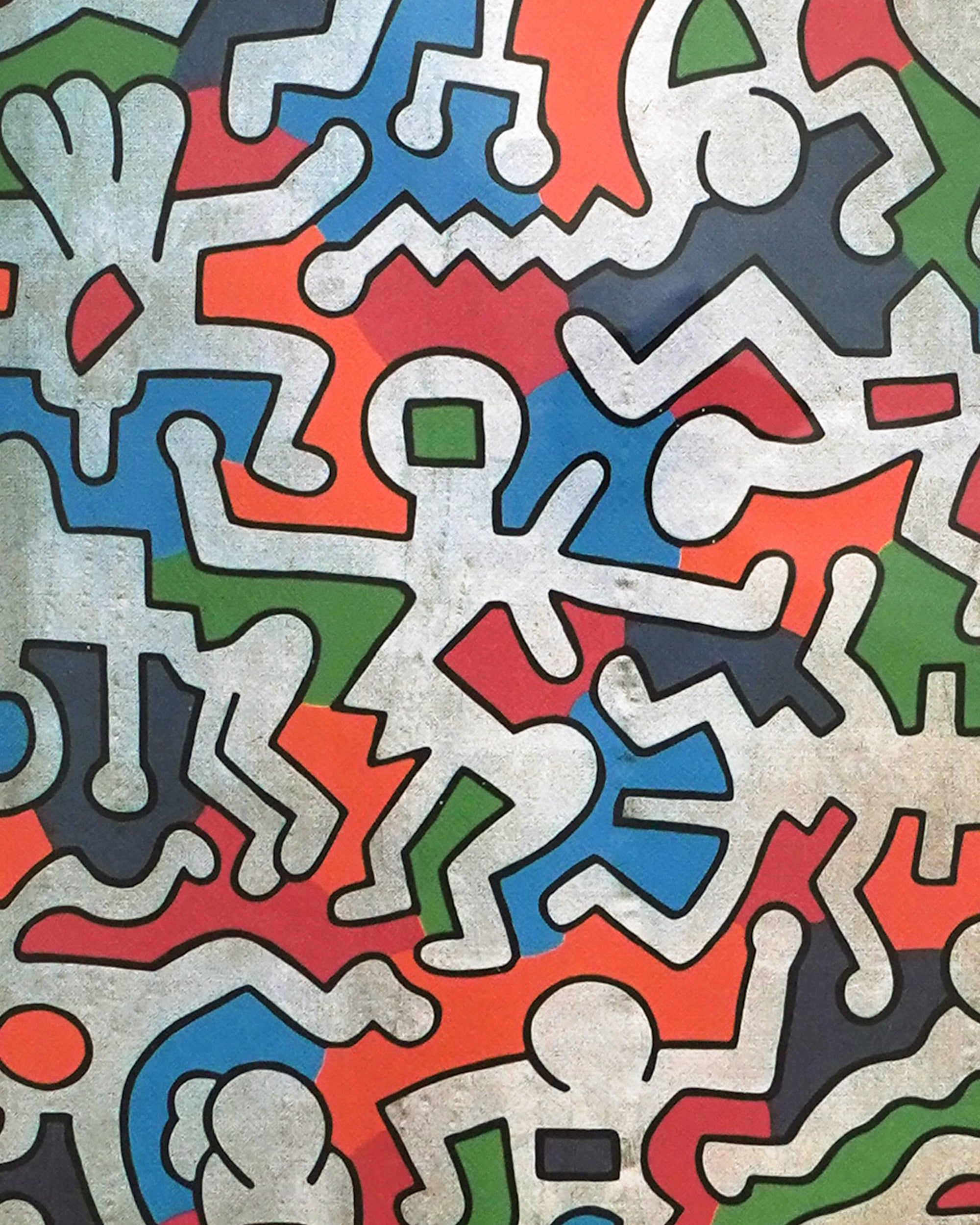 Colorful abstract pattern of stylized human figures on a textured background