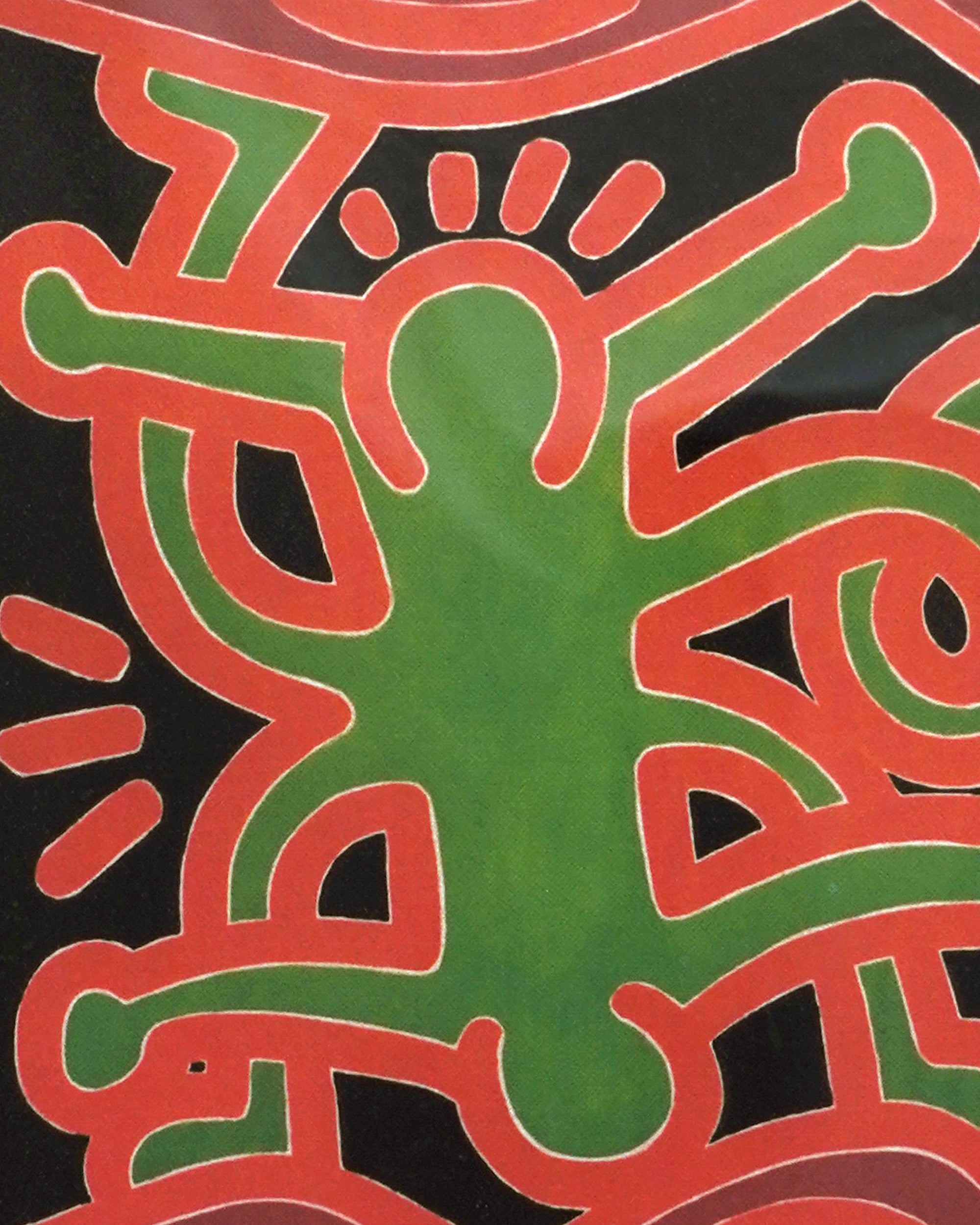 Colorful abstract design with green and red shapes on a black background