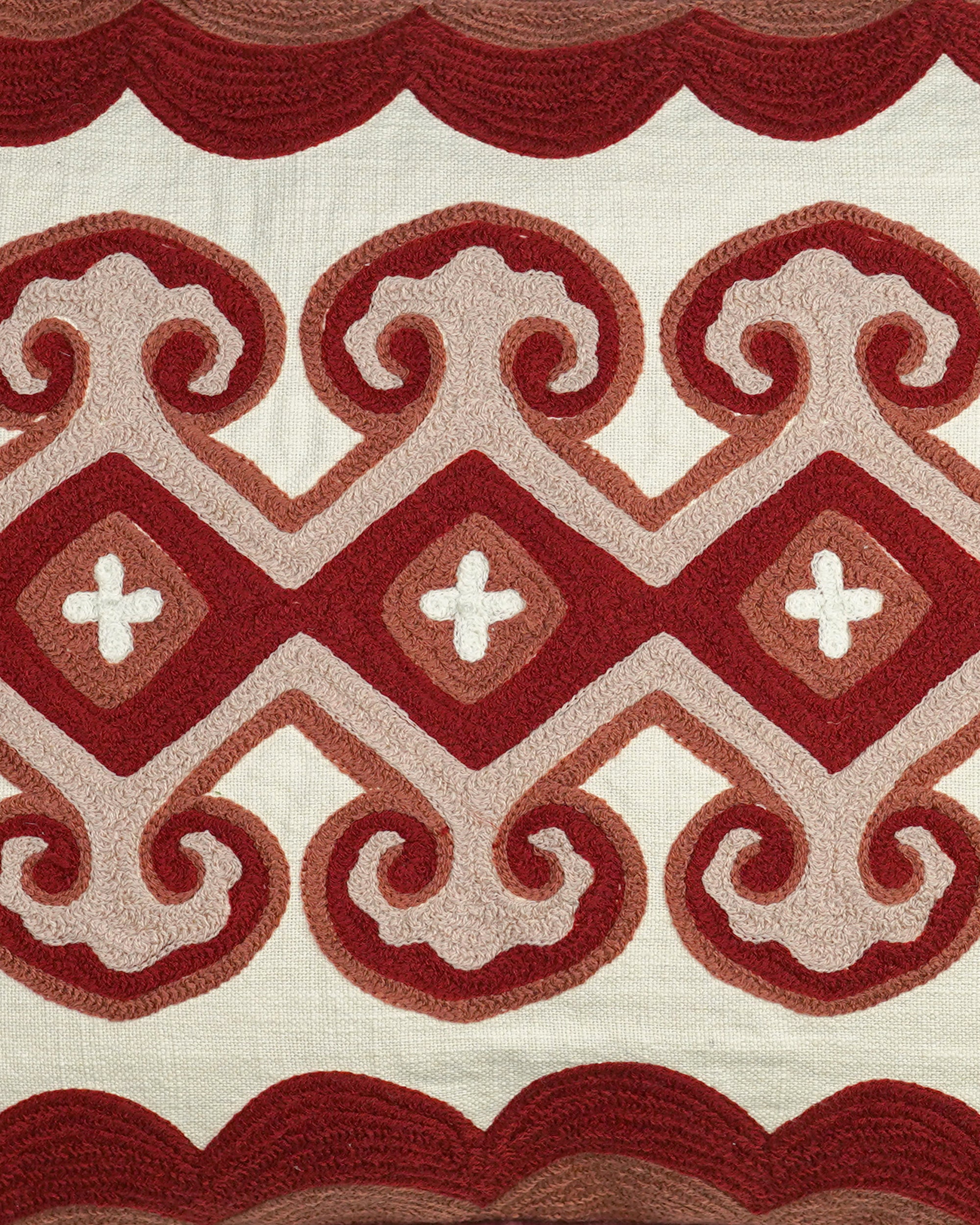 Close up detail of the lattice crewel work cushion in red