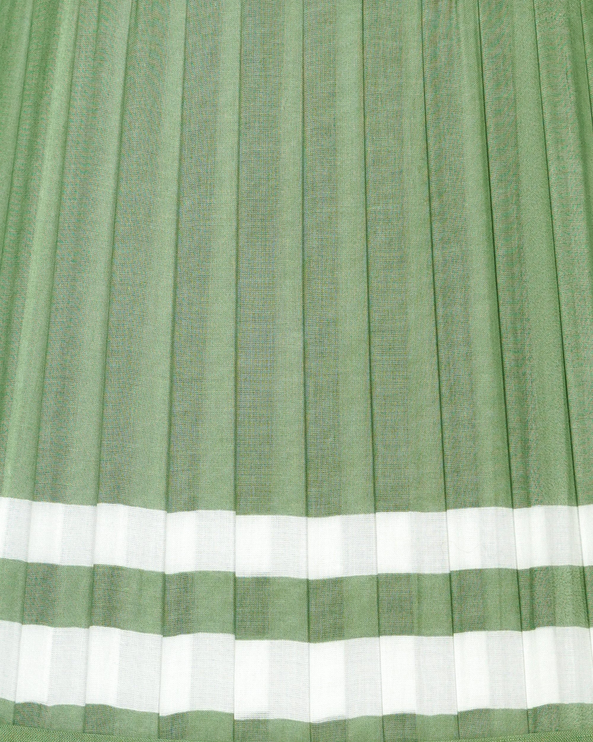 Close-up of green and white striped, pleated lampshade