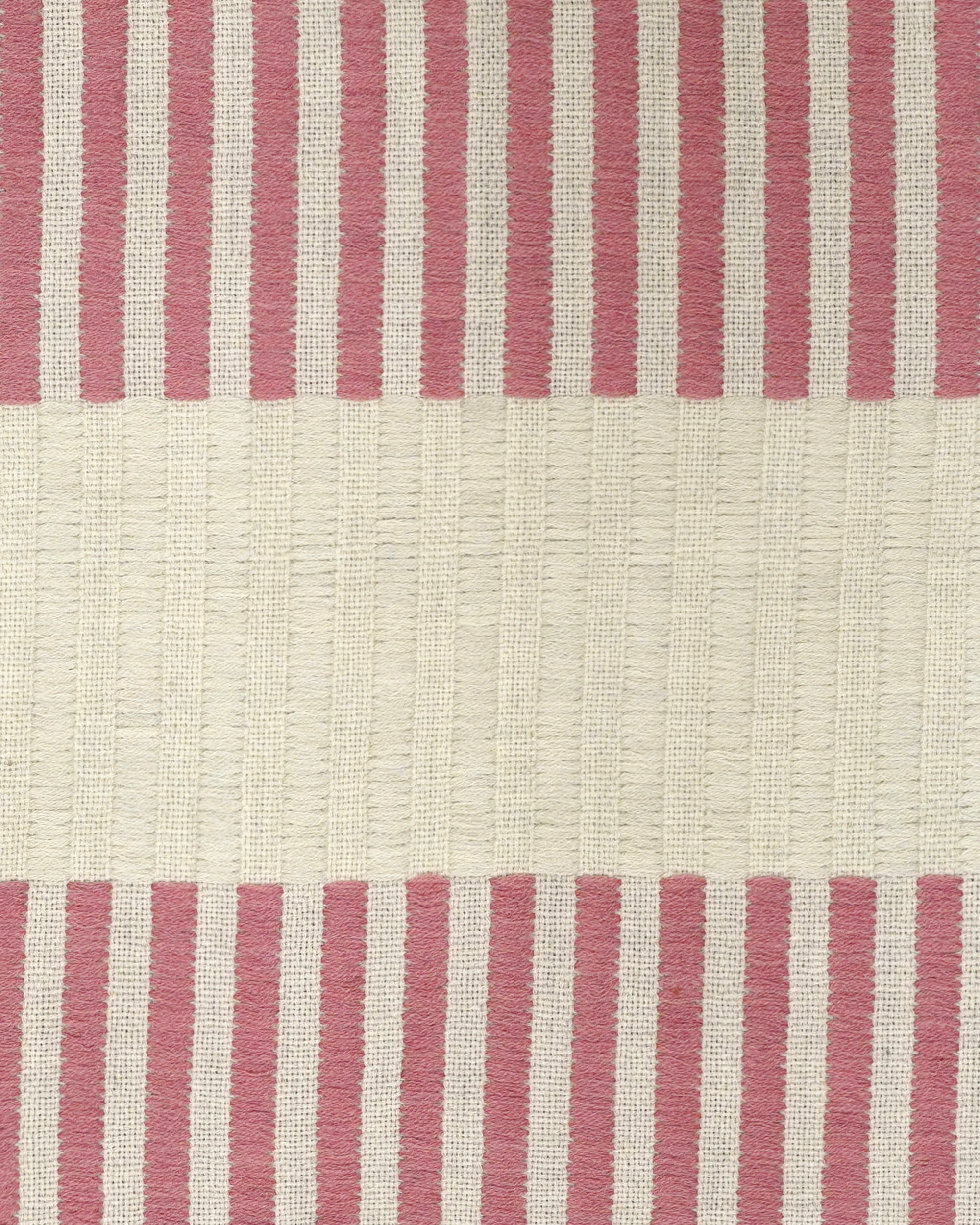 Close up detail of the pink and taupe striped Dopatti throw