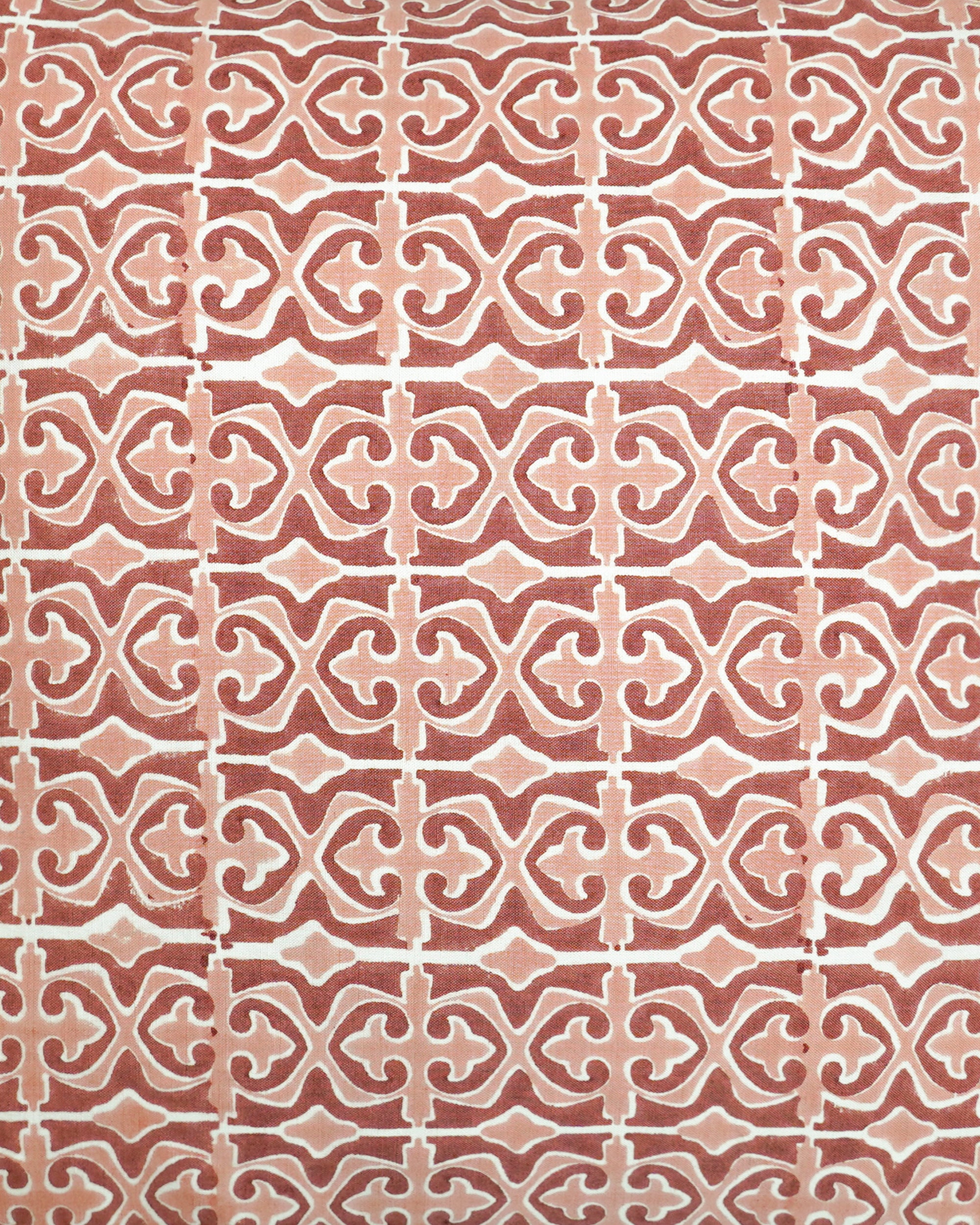 Close up detail image showing the geometric pattern in the pink and red Santa Clara cushion